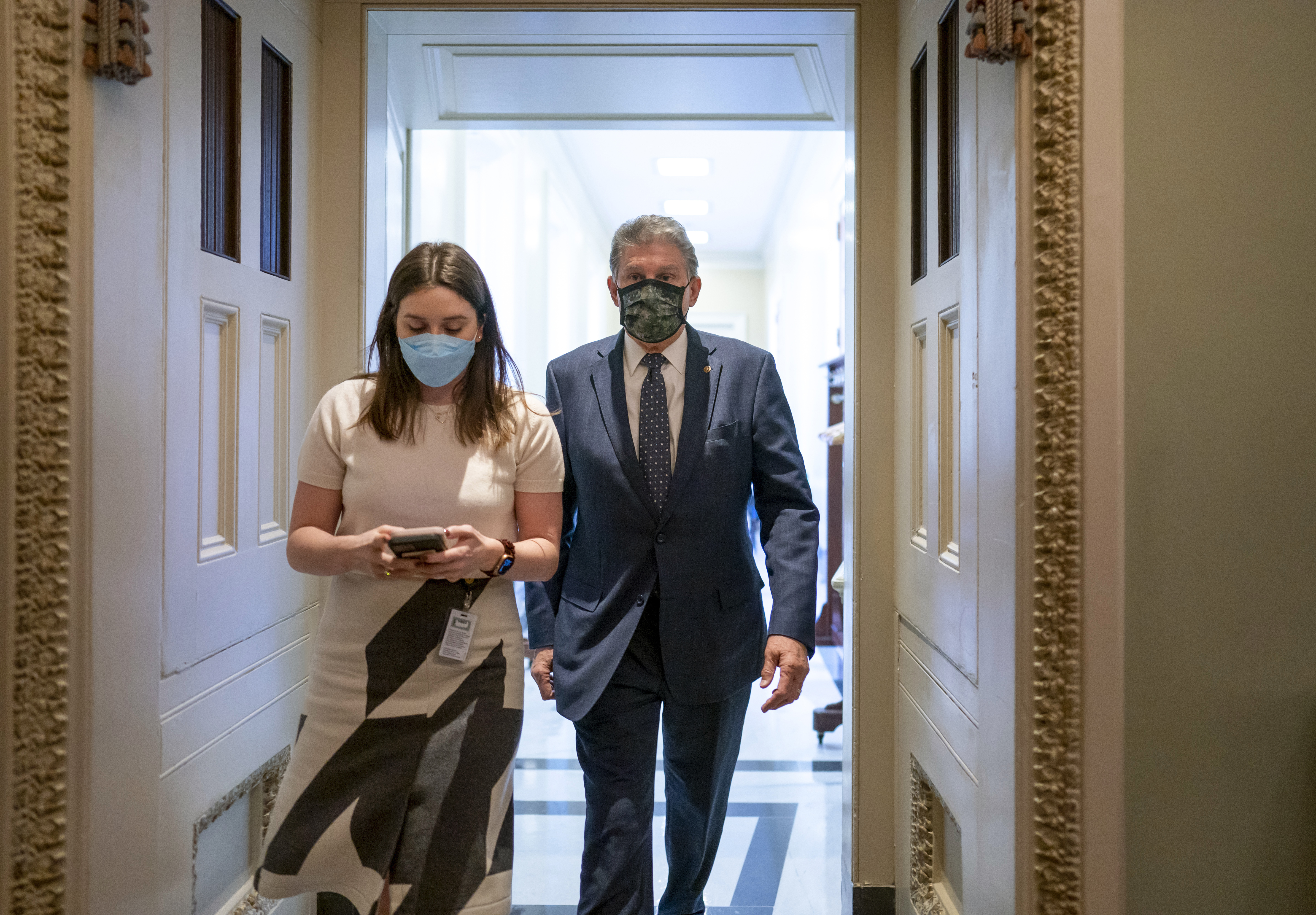Sen. Joe Manchin, D-W.Va., leaves a lengthy Democratic Caucus meeting as the Senate continues to grapple with end-of-year tasks at the Capitol in Washington, Thursday.