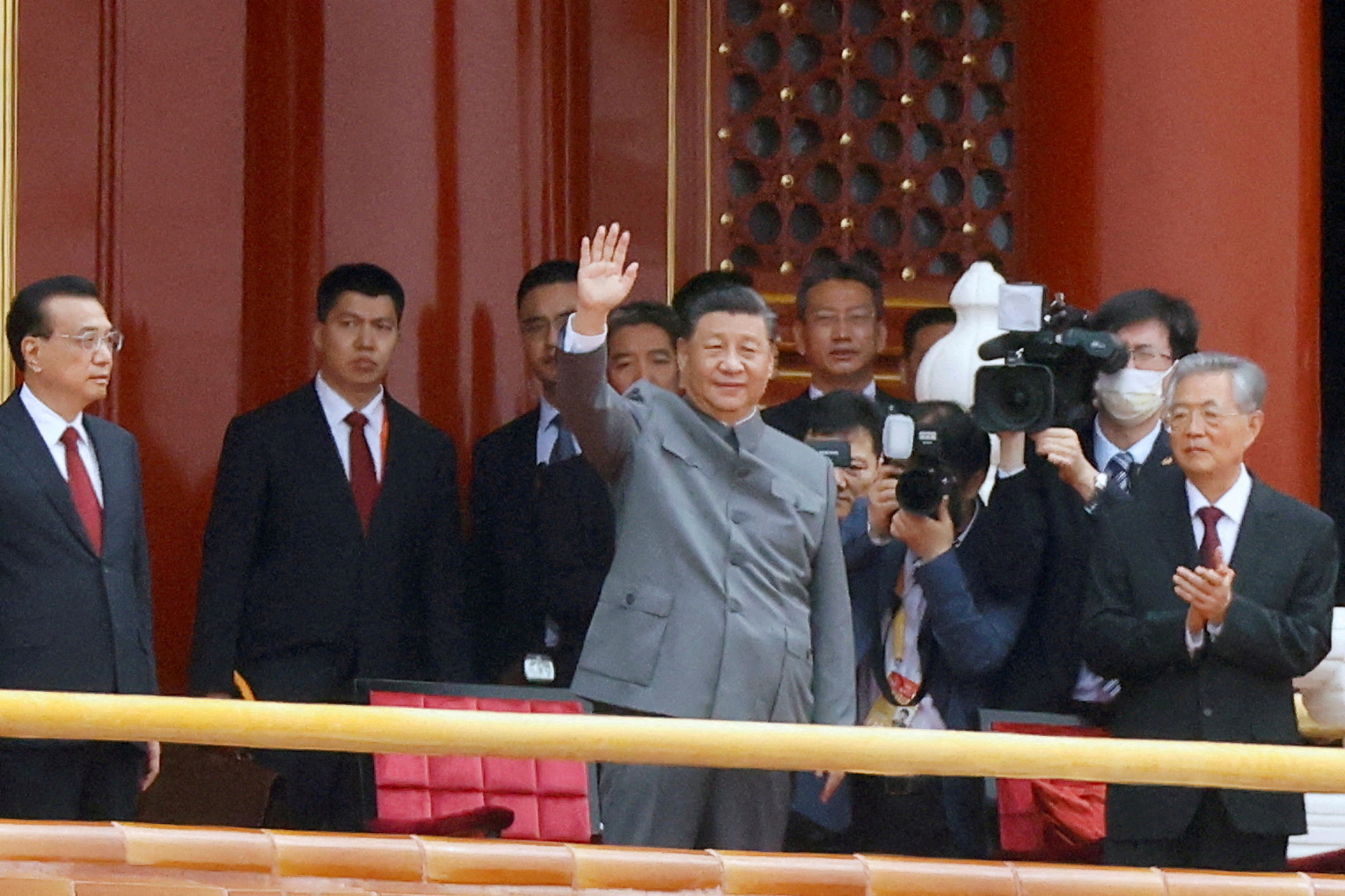 Chinese President Xi Jinping waves next to Premier Li Keqiang and former president Hu Jintao at the end of the event marking the 100th founding anniversary of the Communist Party of China, on Tiananmen Square in Beijing, China July 1.