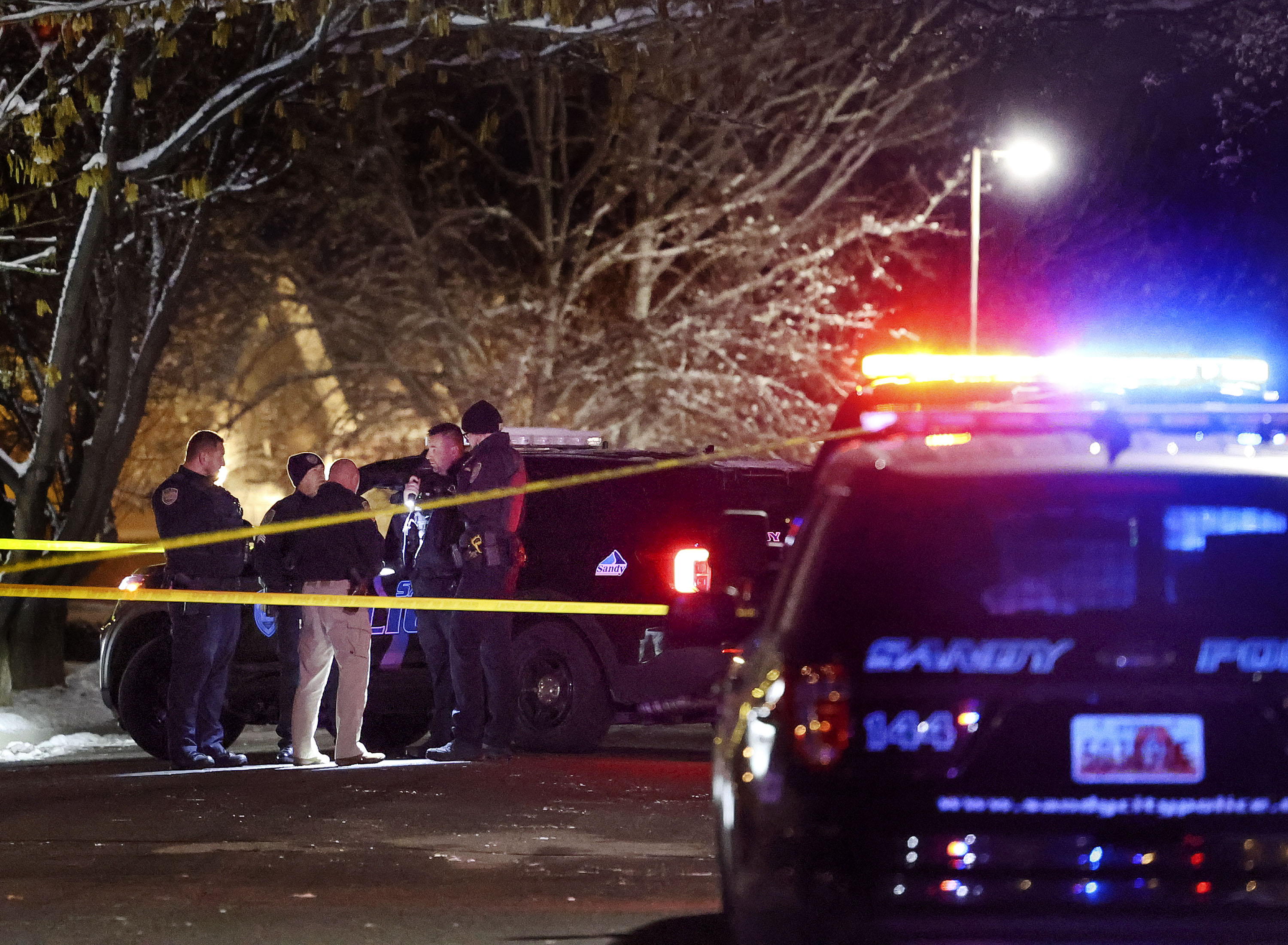 Sandy police officers investigate the scene of a shooting on Montana Drive in Sandy on Friday, Dec. 10. Linda Jonides was shot and killed and her husband, Matthew Jonides, was charged Friday with murder.