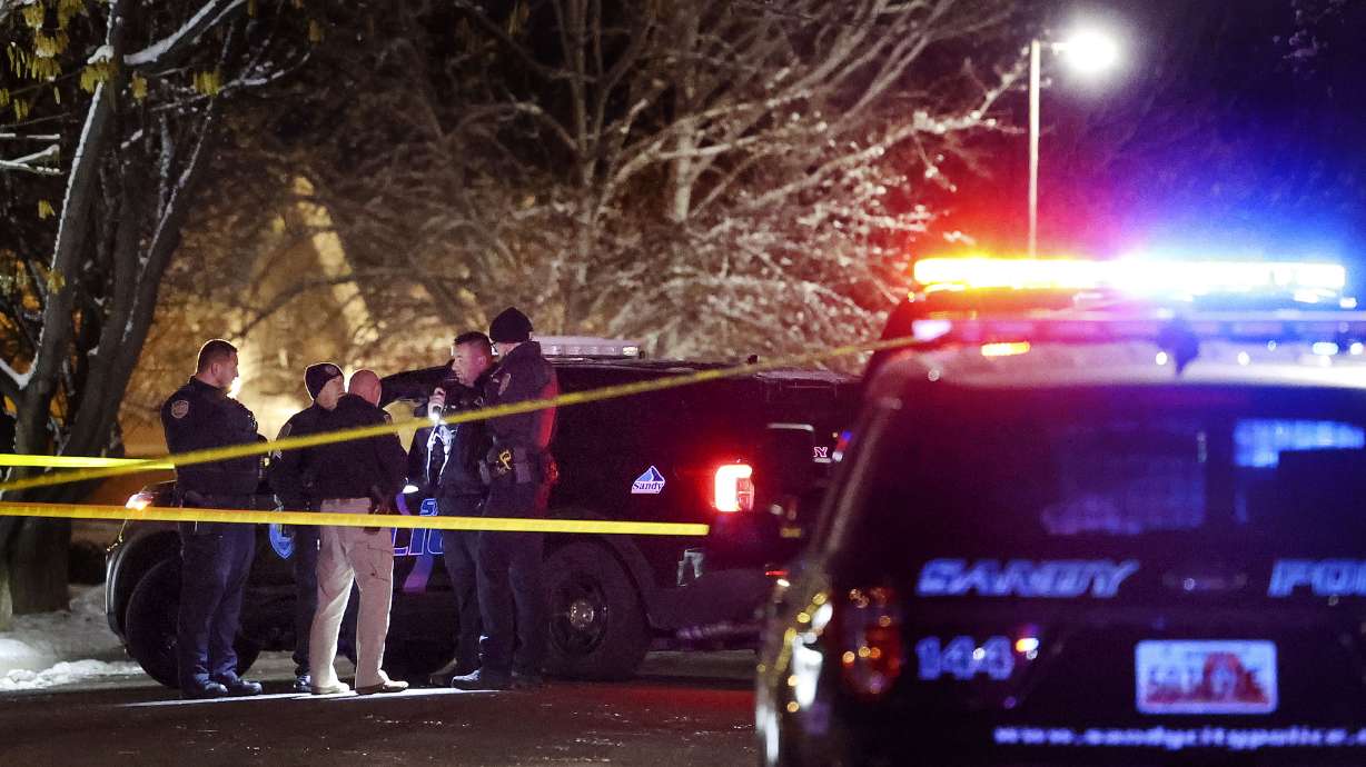 Sandy police officers investigate the scene of a shooting on Montana Drive in Sandy on Friday, Dec. 10. Linda Jonides was shot and killed and her husband, Matthew Jonides, was charged Friday with murder.