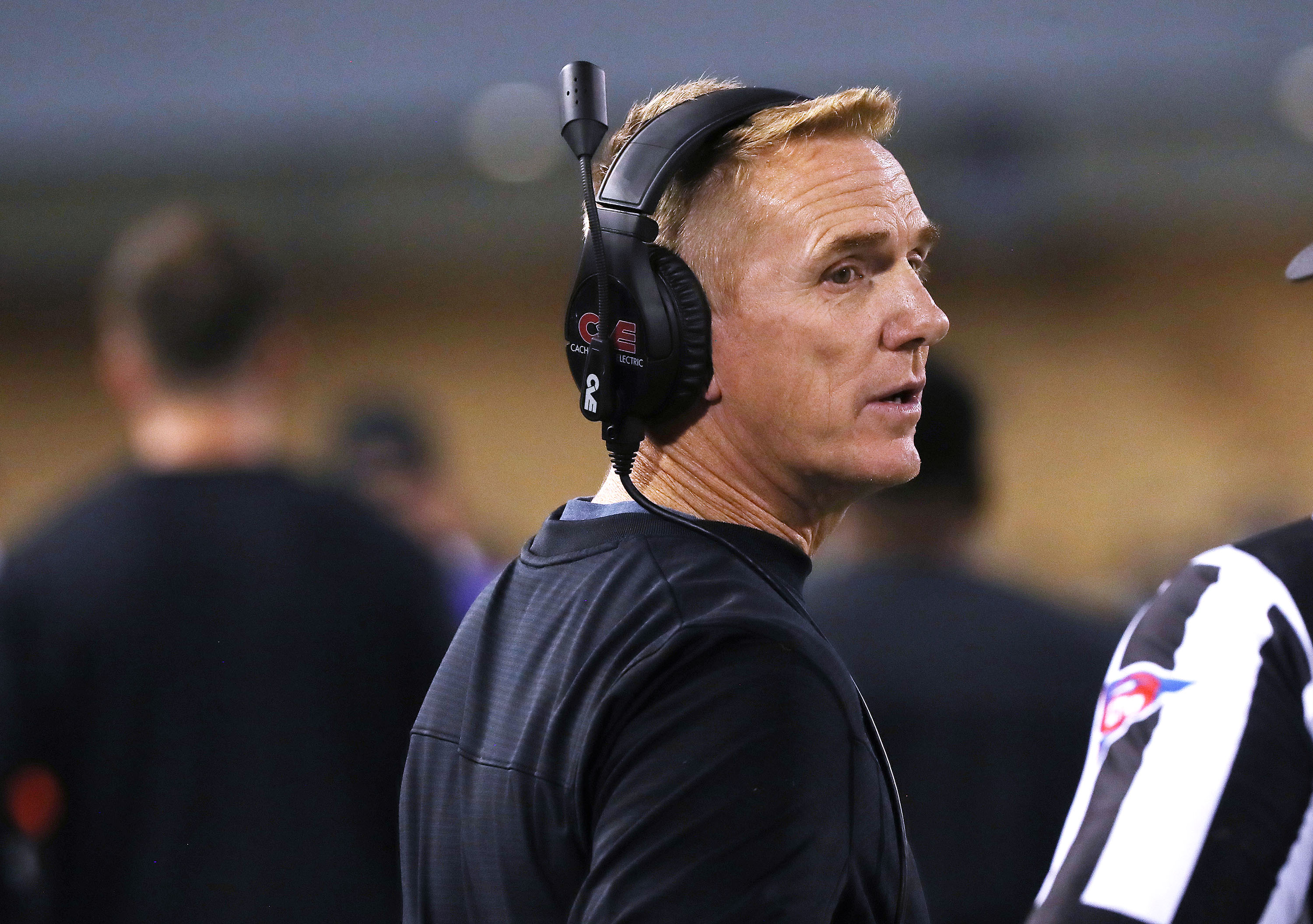 Utah State University football coach Blake Anderson talks with a referee during a game in Logan on Oct 1. Anderson issued an apology Friday for comments he made to the team in August about victims of sexual assault.