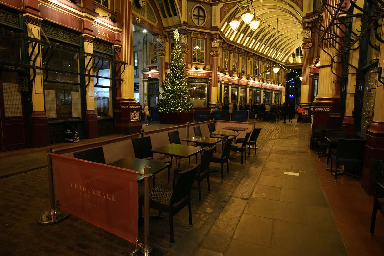 Empty seats outside a restaurant in London, Friday. On what would normally be one of the busiest times for pubs and restaurants just before Christmas, customer numbers are down in central London due to concerns about the new omicron variant. Friday night in Central London was muted with one bar saying they have 30 customers inside when there should have been 170, with large amounts of cancellations in recent days.