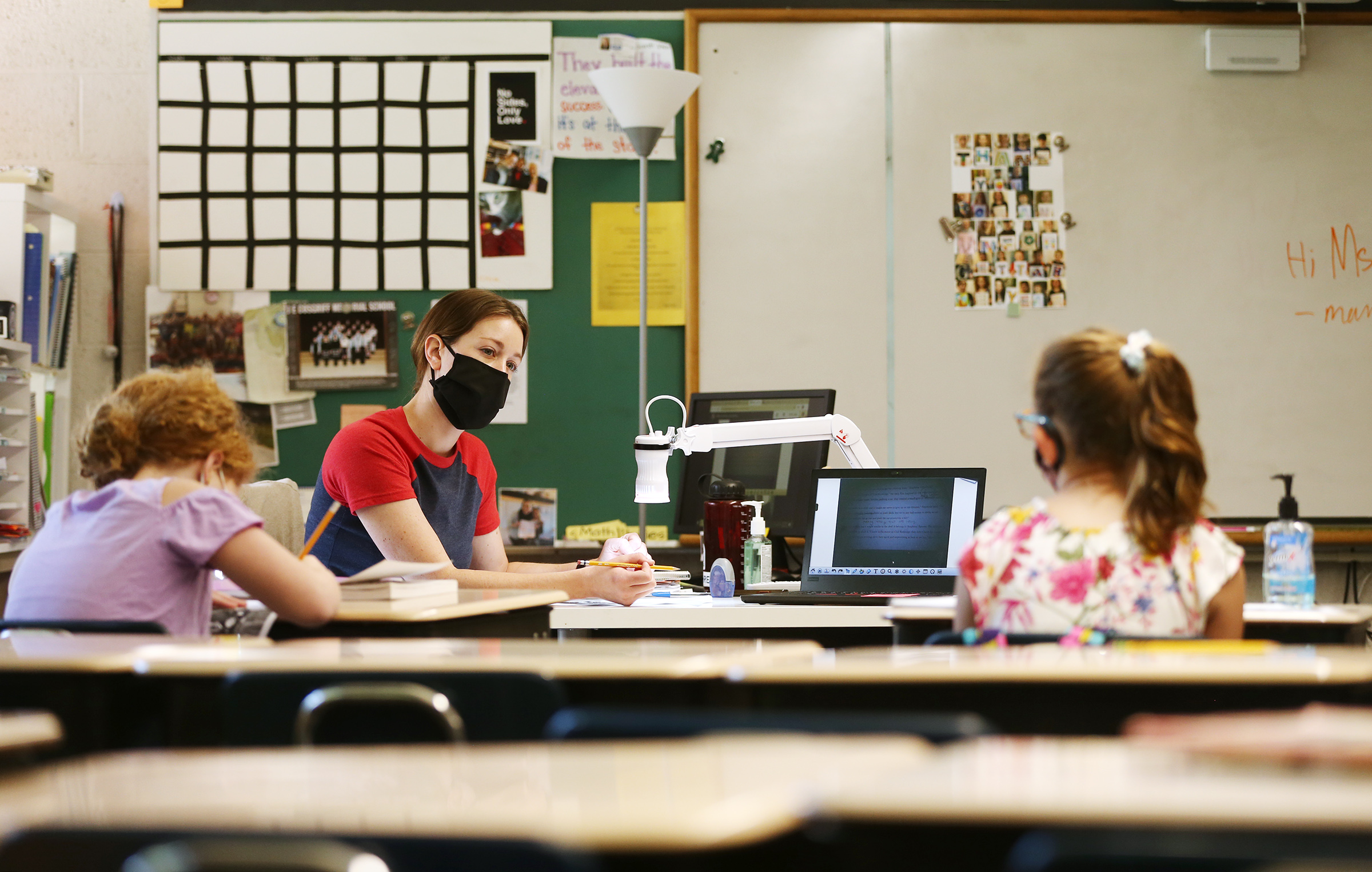 Martina Gehrig works with a couple of students in person and online at J.E. Cosgriff Memorial Catholic School in Salt Lake City on Monday, June 22, 2020. A new online collection housed by the Utah Division of State History shares experiences Utah students have had reflecting on the COVID-19 pandemic for future generations to see.