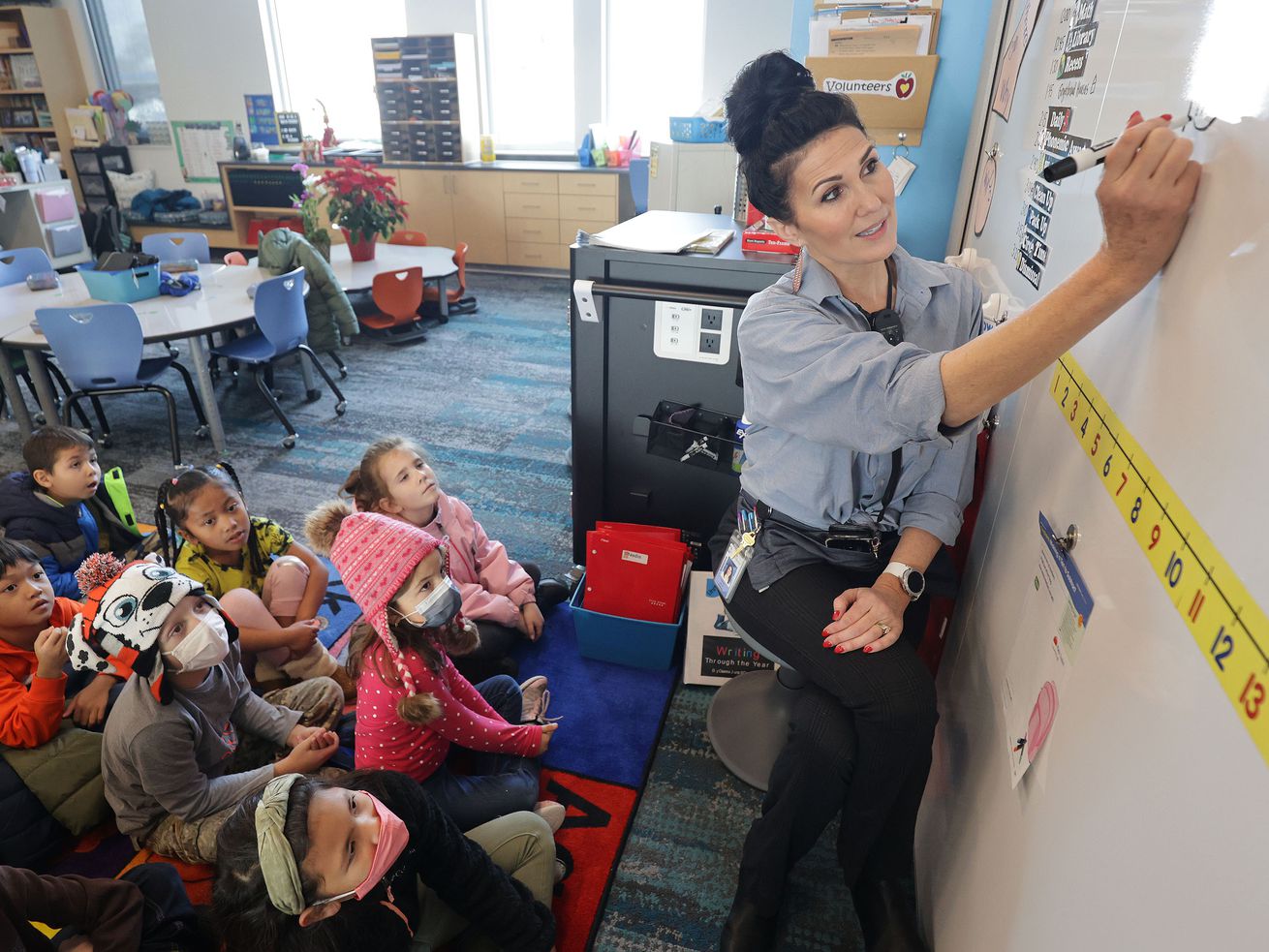 Tiffany Hatch, a first grade teacher at South
Clearfield Elementary in Clearfield, teaches math to her class on
Wednesday.