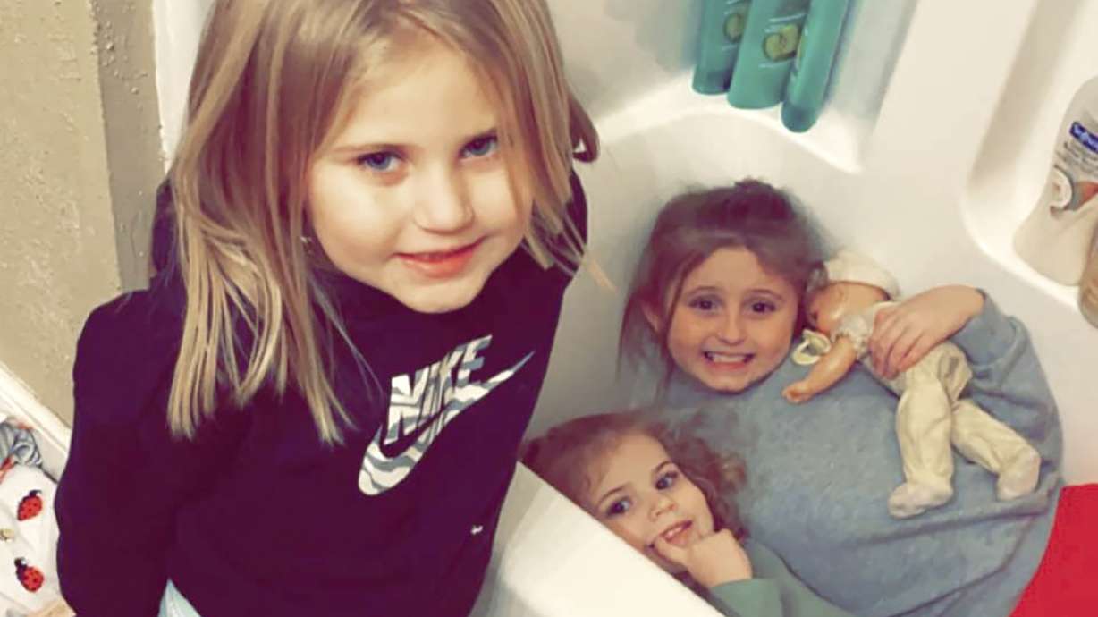 Avalinn Rackley, 7, Alanna Rackley, 3, and Annistyn Rackley, 9, pose for a picture in a bathroom in their home near Caruthersville, Missouri, on Dec. 10. Annistyn, a third-grader who loved swimming, dancing and cheerleading, was among dozens of people who died because of the severe storm on that day.