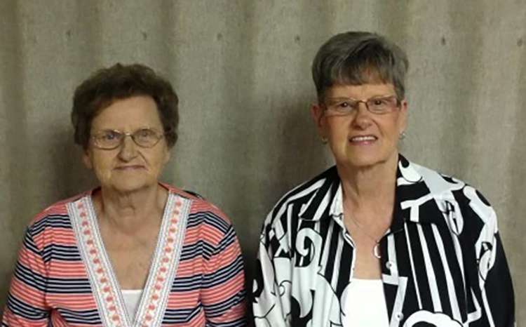 This undated photo shows from left, Carole Grisham and Marsha Hall. The sisters who had worked at the Beshear Funeral Home — 80-year-old Carole Grisham and 72-year-old Marsha Hall — decided to stay put in their home, which lacked a basement, as the tornado barreled down on Dawson Springs, Ky.