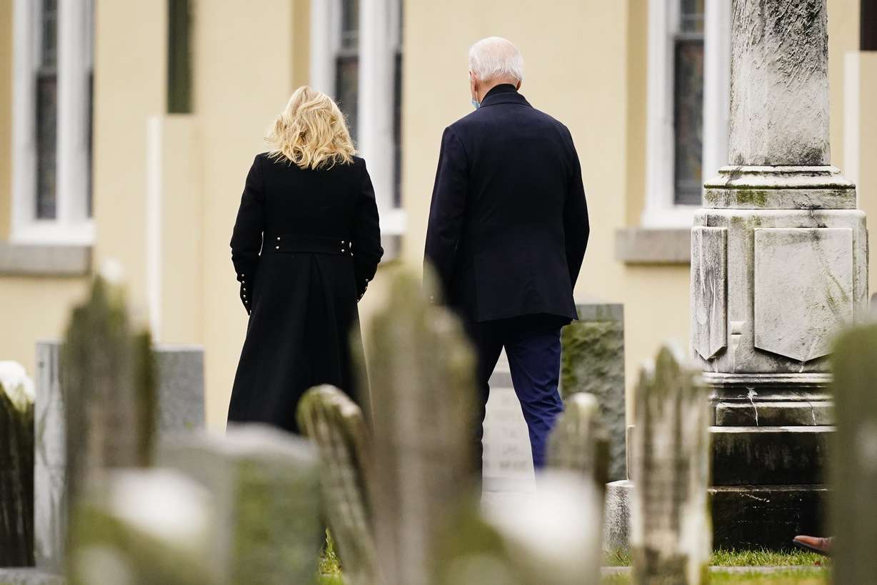 President Joe Biden and first lady Jill Biden walk from St. Joseph on the Brandywine Catholic Church in Wilmington, Del., Saturday, Dec. 18, 2021.