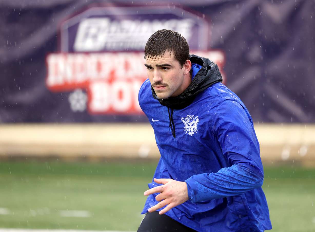 Brigham Young Cougars defensive lineman Tyler Batty (92) goes over some moves as he warms up as BYU and UAB prepare to play in the Radiance Technologies Independence Bowl in Shreveport, Louisiana on Saturday, Dec. 18, 2021.