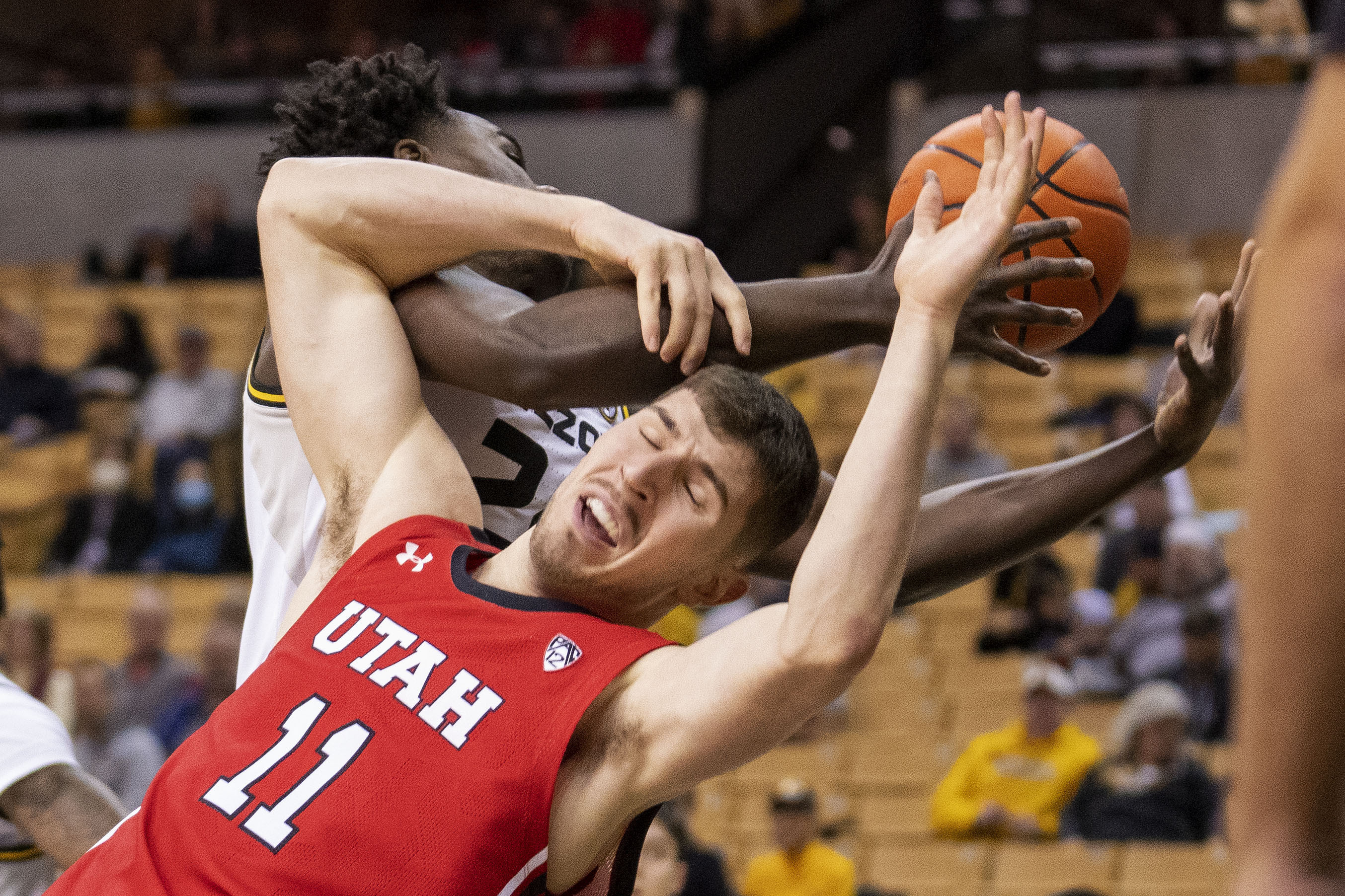 Utah's Riley Battin (11) battles Missouri's Kobe Brown for a rebound during the first half of an NCAA college basketball game Saturday, Dec. 18, 2021, in Columbia, Mo.
