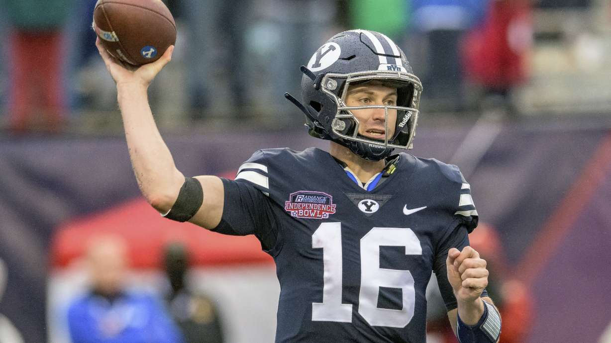 BYU quarterback Baylor Romney (16) looks to throw during the first half of the Independence Bowl NCAA college football game against UAB in Shreveport, La., Saturday, Dec. 18, 2021.