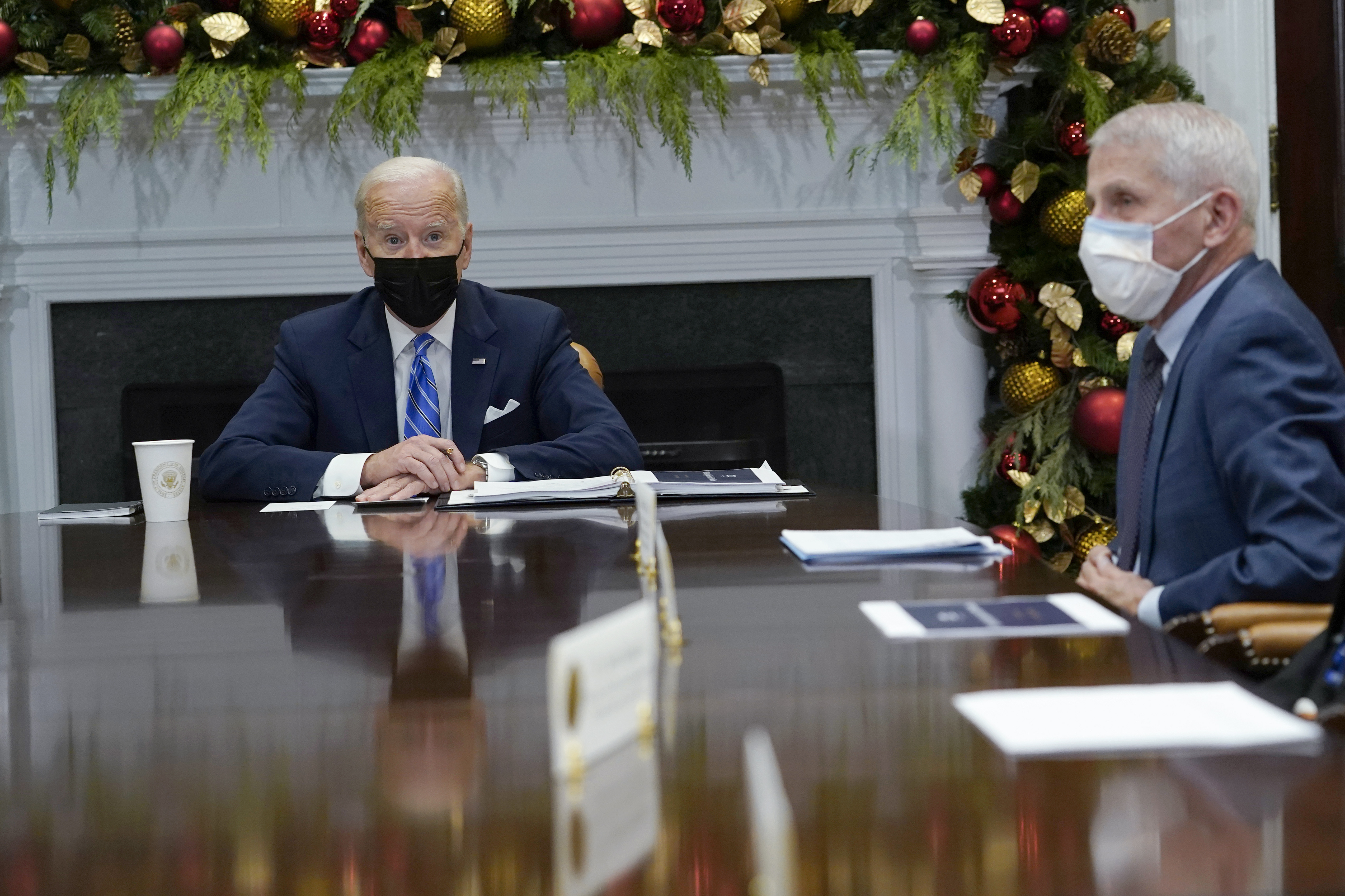 President Joe Biden speaks as he meets with members of the White House COVID-19 Response Team in the Roosevelt Room of the White House in Washington, D.C., on Dec. 16. Dr. Anthony Fauci, director of the National Institute of Allergy and Infectious Diseases, sits at right.