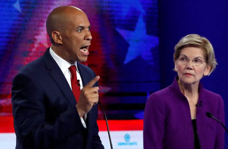 Sen. Cory Booker speaks as Sen. Elizabeth Warren listens at the first U.S. 2020 presidential election Democratic candidates debate in Miami on June 26, 2019.