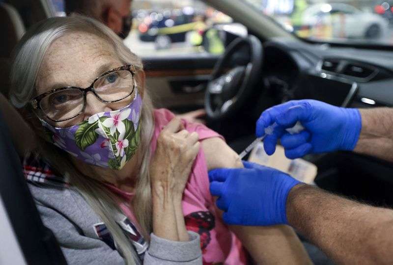 Klea Pribble, of Sunset, gets a Pfizer COVID-19 booster shot at the Legacy Events Center in Farmington on Monday, Oct. 25.