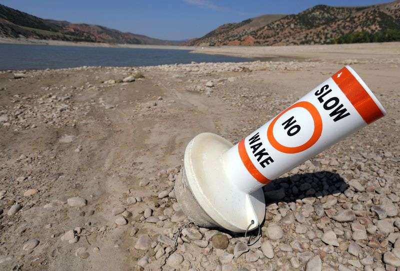 A marker buoy is grounded on the dried-up shore of Echo
Reservoir, which is currently at 12% capacity, at Echo State Park
during a drought on Thursday, Sept. 16.