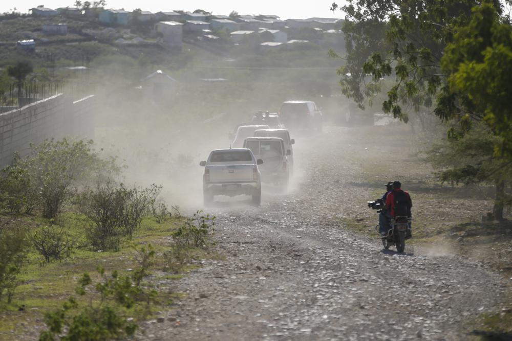 A caravan drives to the airport after departing from the Christian Aid Ministries headquarters at Titanyen, north of Port-au-Prince, Haiti, Dec. 16, 2021. A woman from New Hampshire who works for a nonprofit organization in Haiti and her young daughter have been reported as kidnapped as the U.S. State Department issued a "do not travel advisory" in the country.