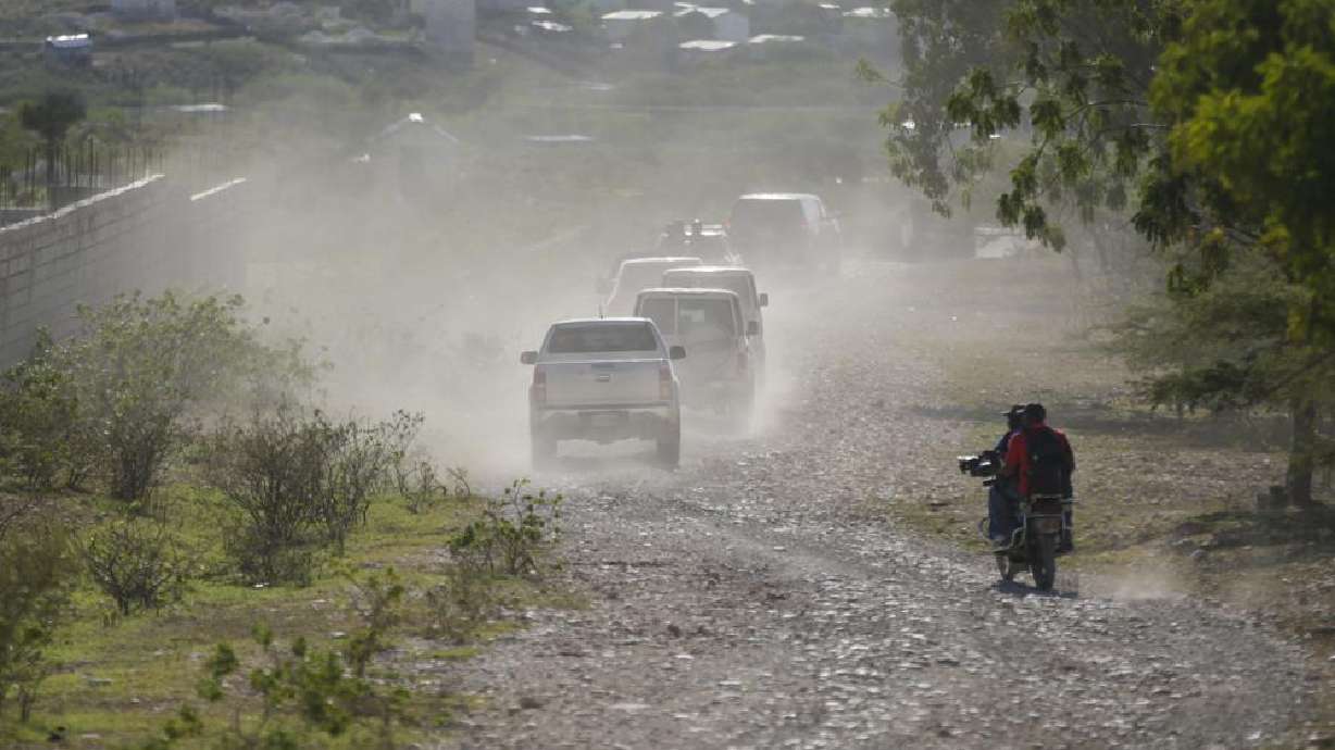 A caravan drives to the airport after departing from the Christian Aid Ministries headquarters at Titanyen, north of Port-au-Prince, Haiti, Dec. 16, 2021. A woman from New Hampshire who works for a nonprofit organization in Haiti and her young daughter have been reported as kidnapped as the U.S. State Department issued a "do not travel advisory" in the country.