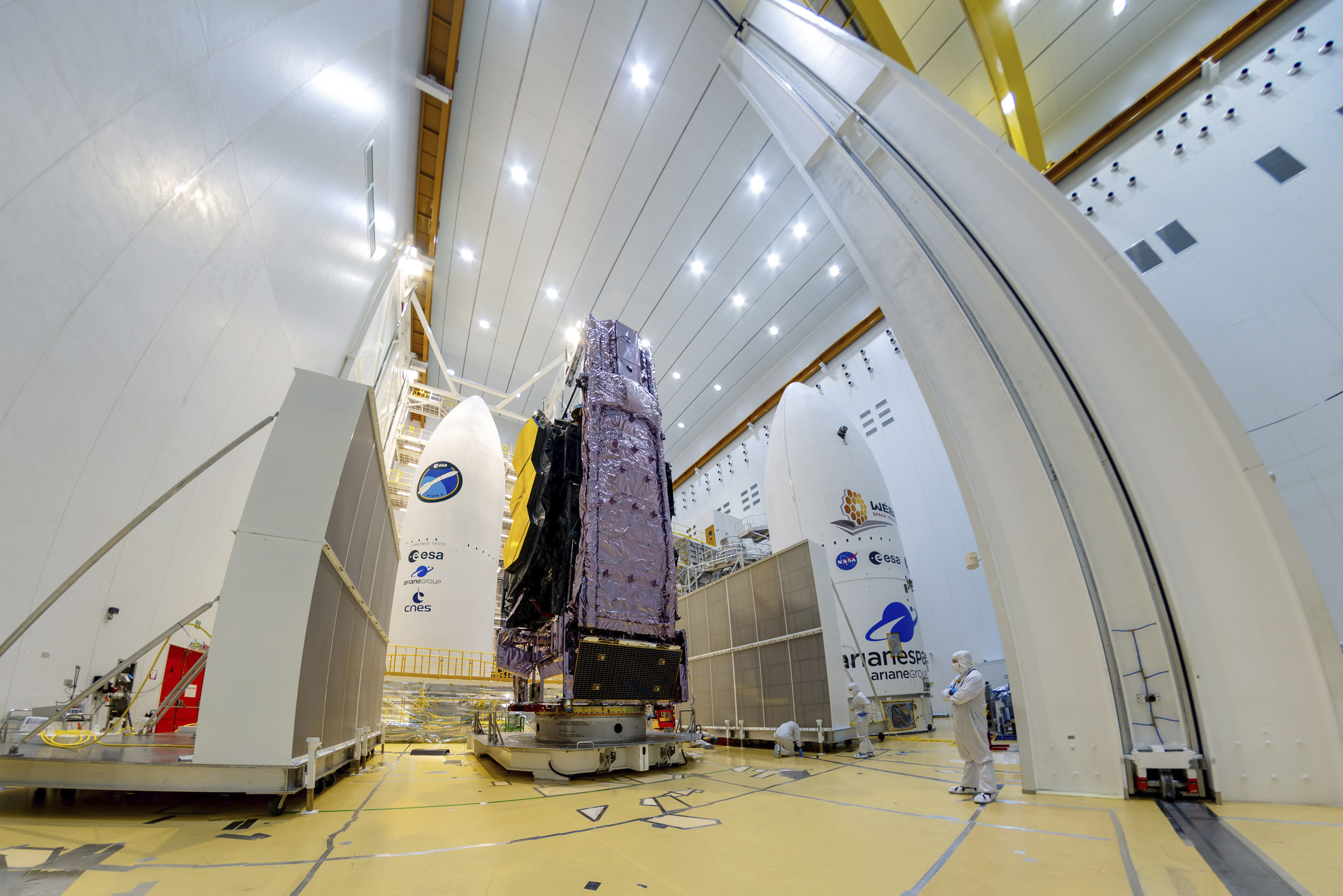 The NASA James Webb Space Telescope is mounted on top of the Ariane 5 rocket Saturday, Dec. 11, 2021, that will launch it from Europe's Spaceport in French Guiana. Webb is so big that it had to be folded origami-style to fit into the nose cone of the rocket.