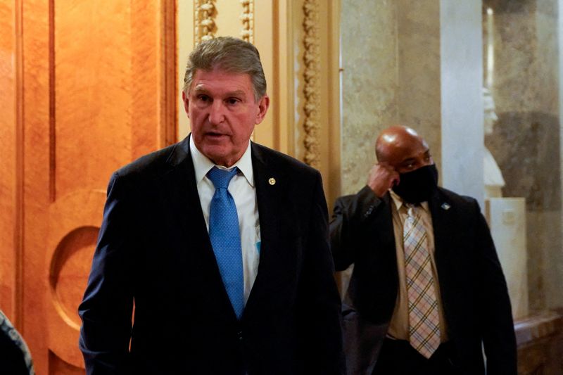 U.S. Senator Joe Manchin (D-WV) leaves the Senate floor after a vote at the Capitol building in Washington, Dec. 9.