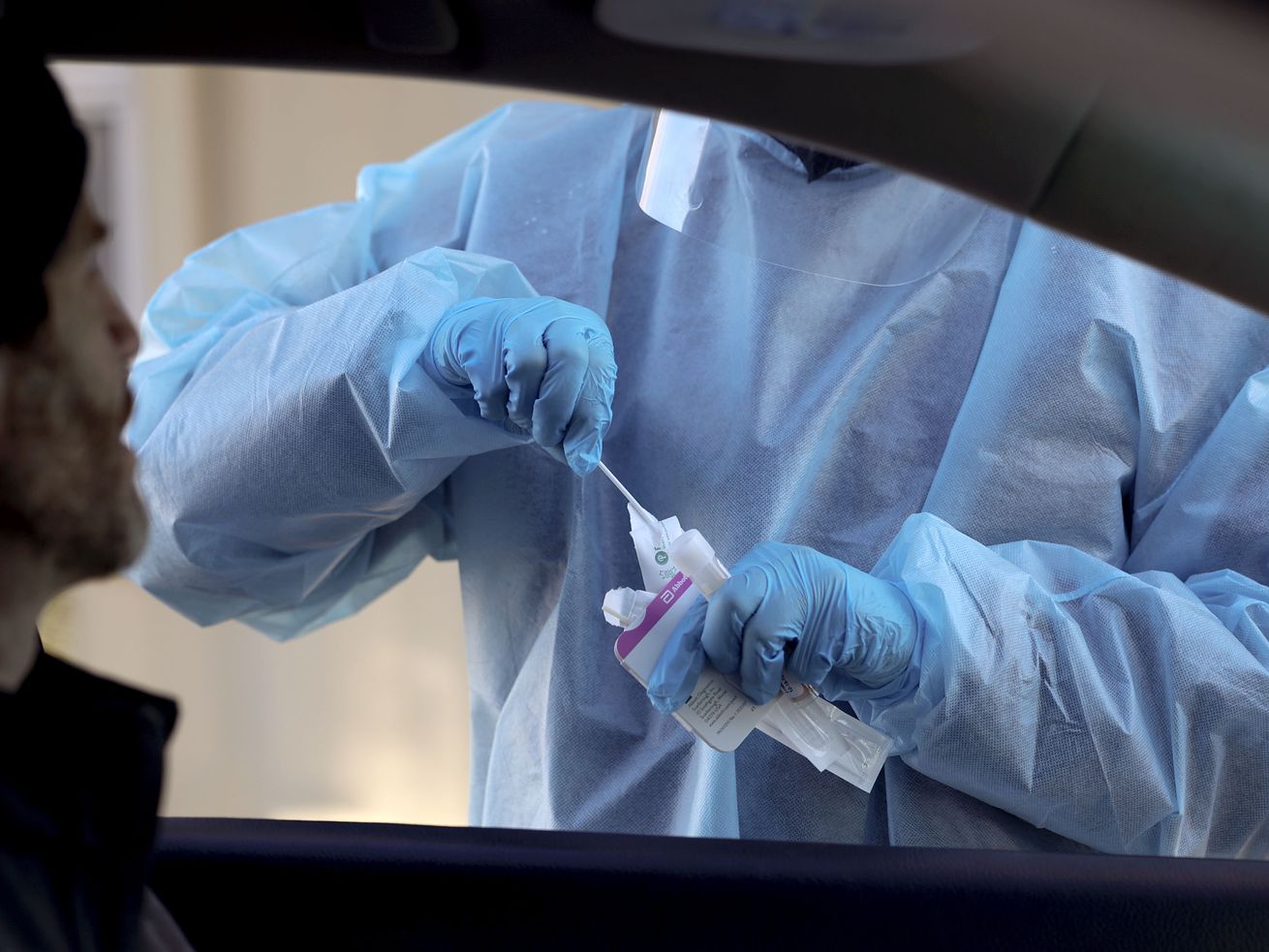 Corey Lewis waits to receive a COVID-19 test at the
Cannon Health Building in Salt Lake City on Dec. 15. Utah officials are concerned about the emergence of the
omicron variant of the coronavirus.