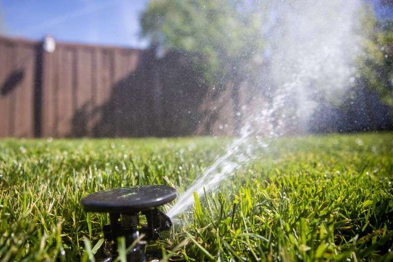 Sprinklers water a lawn in Salt Lake City on Friday,
May 7, 2021.