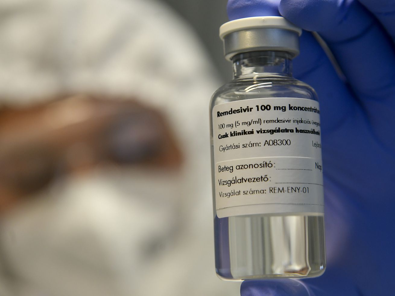 A bottle containing the drug remdesivir is held by a health worker at the Institute of Infectology of Kenezy Gyula Teaching Hospital of the University of Debrecen in Debrecen, Hungary, Oct. 15, 2020.