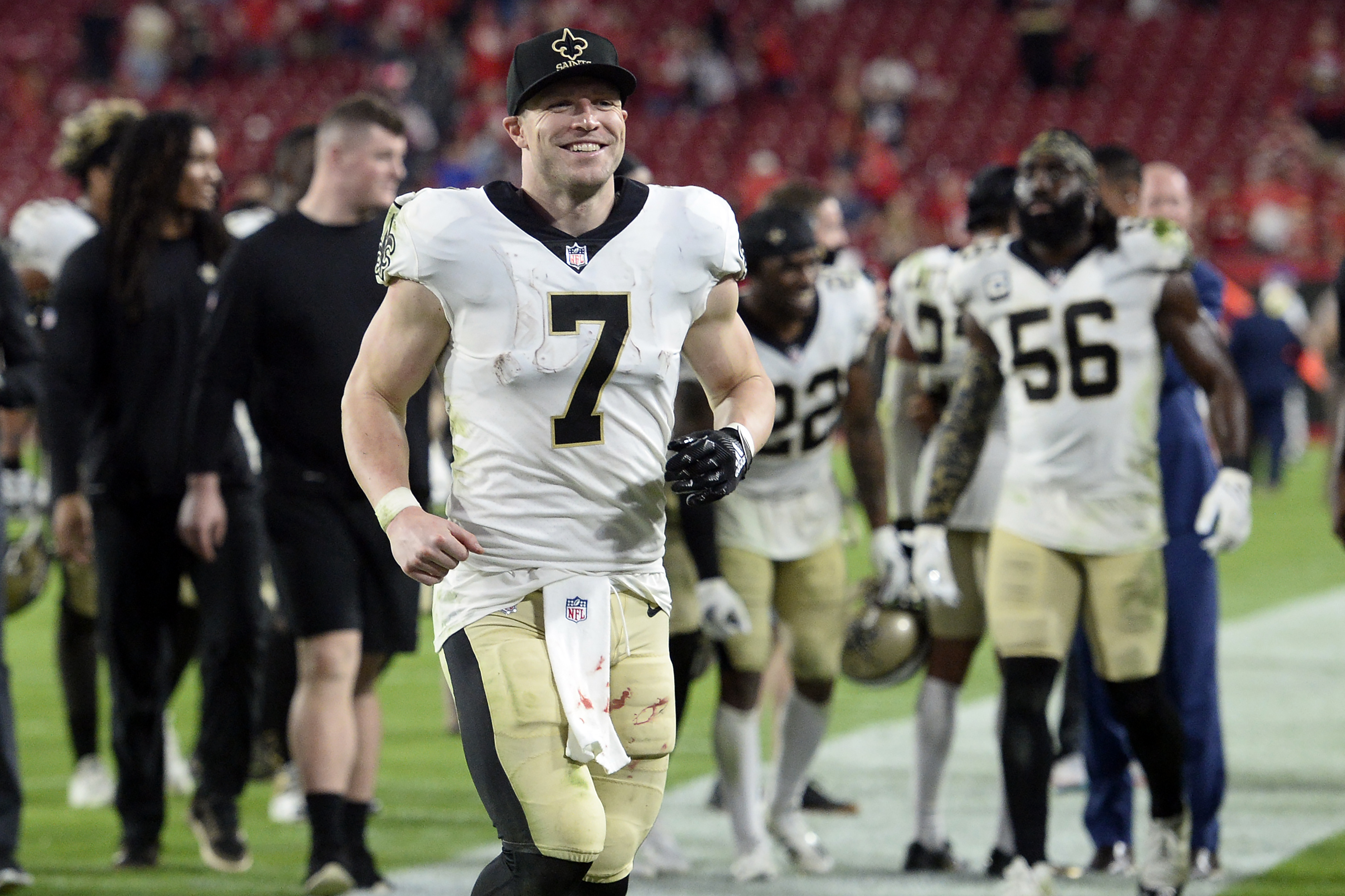 New Orleans Saints quarterback Taysom Hill (7) smiles as he leaves the field after the team defeated the Tampa Bay Buccaneers during an NFL football game Sunday, Dec. 19, 2021, in Tampa, Fla.