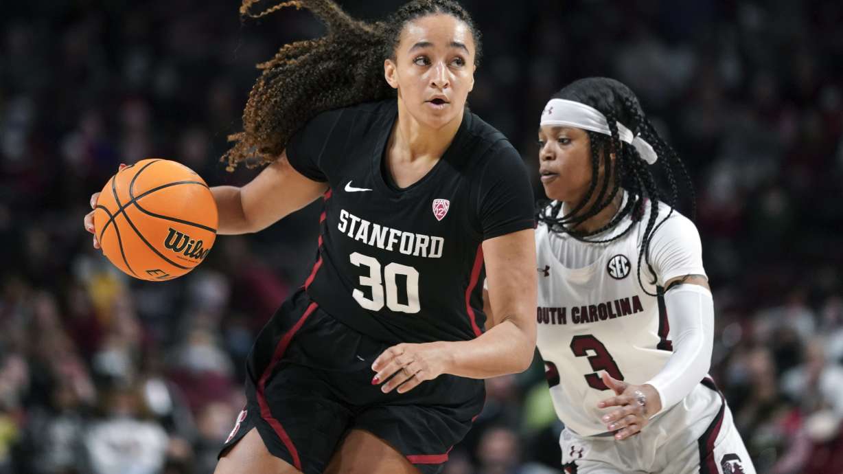 Stanford guard Haley Jones (30) dribbles the ball against South Carolina guard Destanni Henderson (3) during the second half of an NCAA college basketball game against Stanford Tuesday, Dec. 21, 2021, in Columbia, S.C. South Carolina won 65-61.