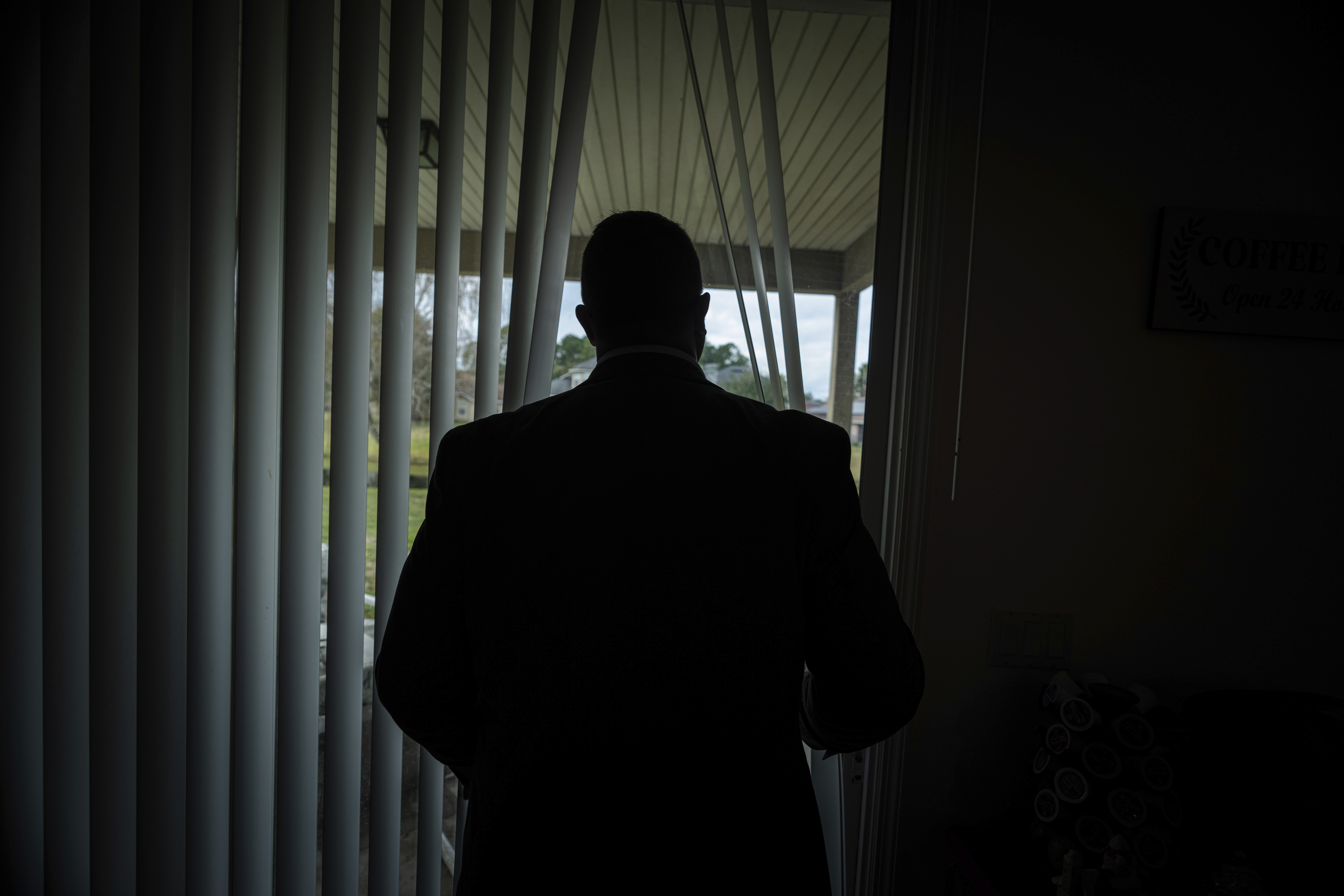 Joseph Moore looks out of a window at his home in Jacksonville, Fla., on Dec. 7. Moore worked for nearly 10 years as an undercover informant for the FBI, infiltrating the Ku Klux Klan in Florida, foiling at least two murder plots.