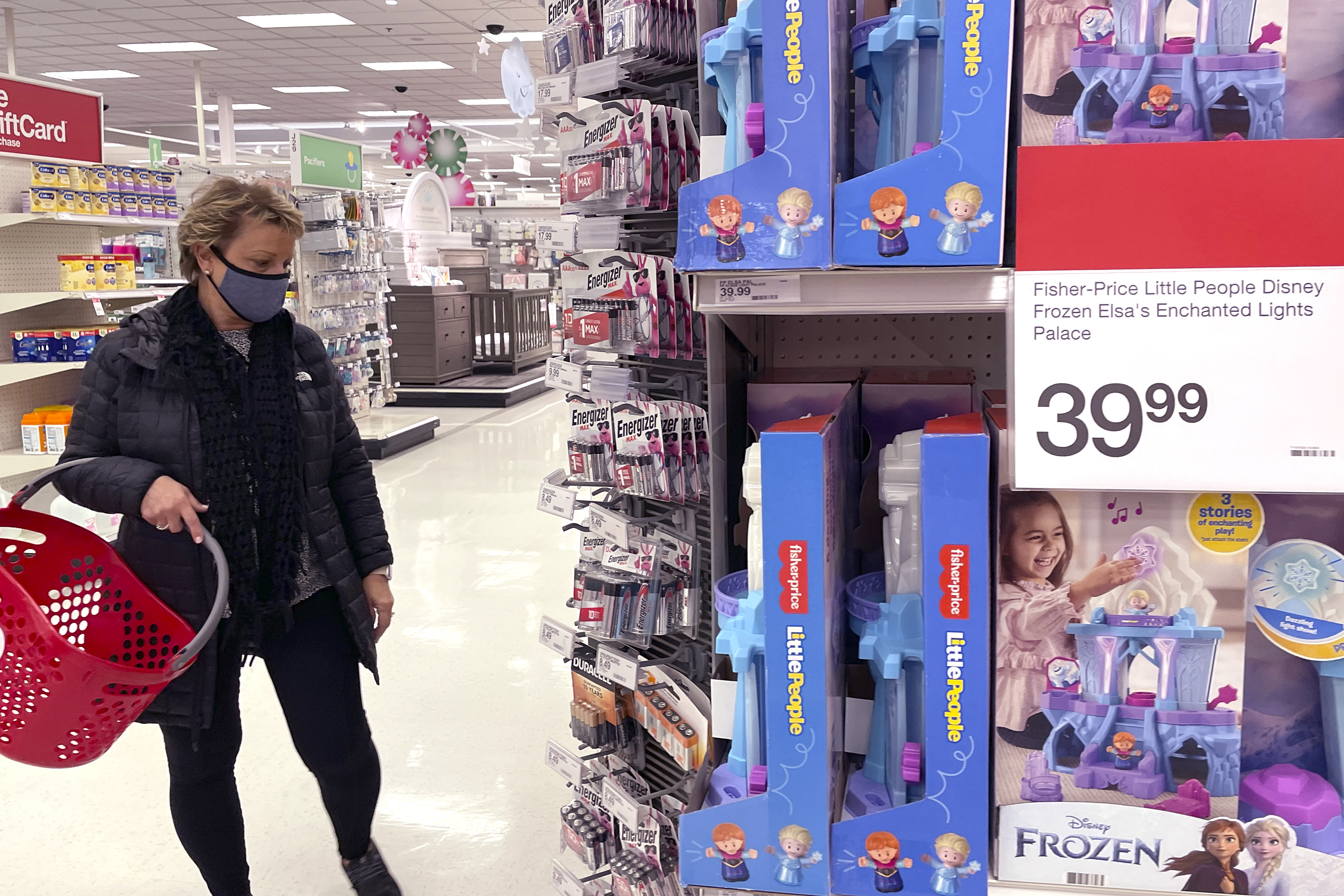 A shopper shops at a retail store in Glenview, Ill., Dec. 16. The National Retail federation said this month that the holiday shopping season appears to be on pace to exceed its sales growth forecast of between 8.5% and 10.5%.