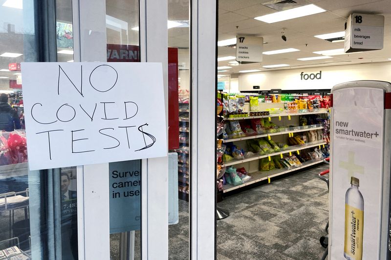A hand-written sign reading "No Covid Tests" is attached to the door, warning customers shopping for a home test for the coronavirus disease that it is out of stock at a CVS store in Somerville, Massachusetts, on Wednesday.