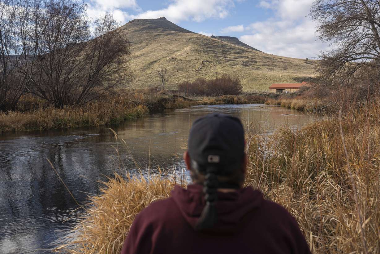 Johnson Bill looks toward a failing water treatment plant that provides water to more than 4,000 people on Tuesday, Dec. 7, 2021, in Warm Springs, Ore. The massive infrastructure bill signed earlier this year promises to bring change to many Native American tribes that lack clean water or indoor plumbing through the largest single infusion of money into Indian Country. It also delivers money for water projects through other federal agencies.