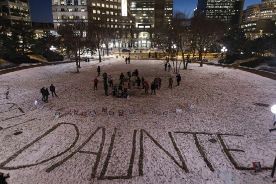 Protesters write Daunte Wright's name in the snow on the third day of jury deliberation outside of the Hennepin County Government Center on Wednesday in Minneapolis. Former Minneapolis police officer Kim Potter, who is white, was charged with first- and second-degree manslaughter in the shooting of Wright, a Black motorist, in the suburb of Brooklyn Center. Potter has said she meant to use her Taser — but grabbed her handgun instead — after Wright tried to drive away as officers were trying to arrest him.