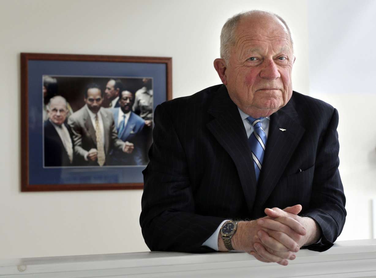 Famed defense attorney F. Lee Bailey poses in his office in Yarmouth, Maine on May 22, 2014. The celebrity attorney who defended O.J. Simpson, Patricia Hearst and the alleged Boston Strangler, but whose legal career halted when he was disbarred in two states died on June 3, 2021.