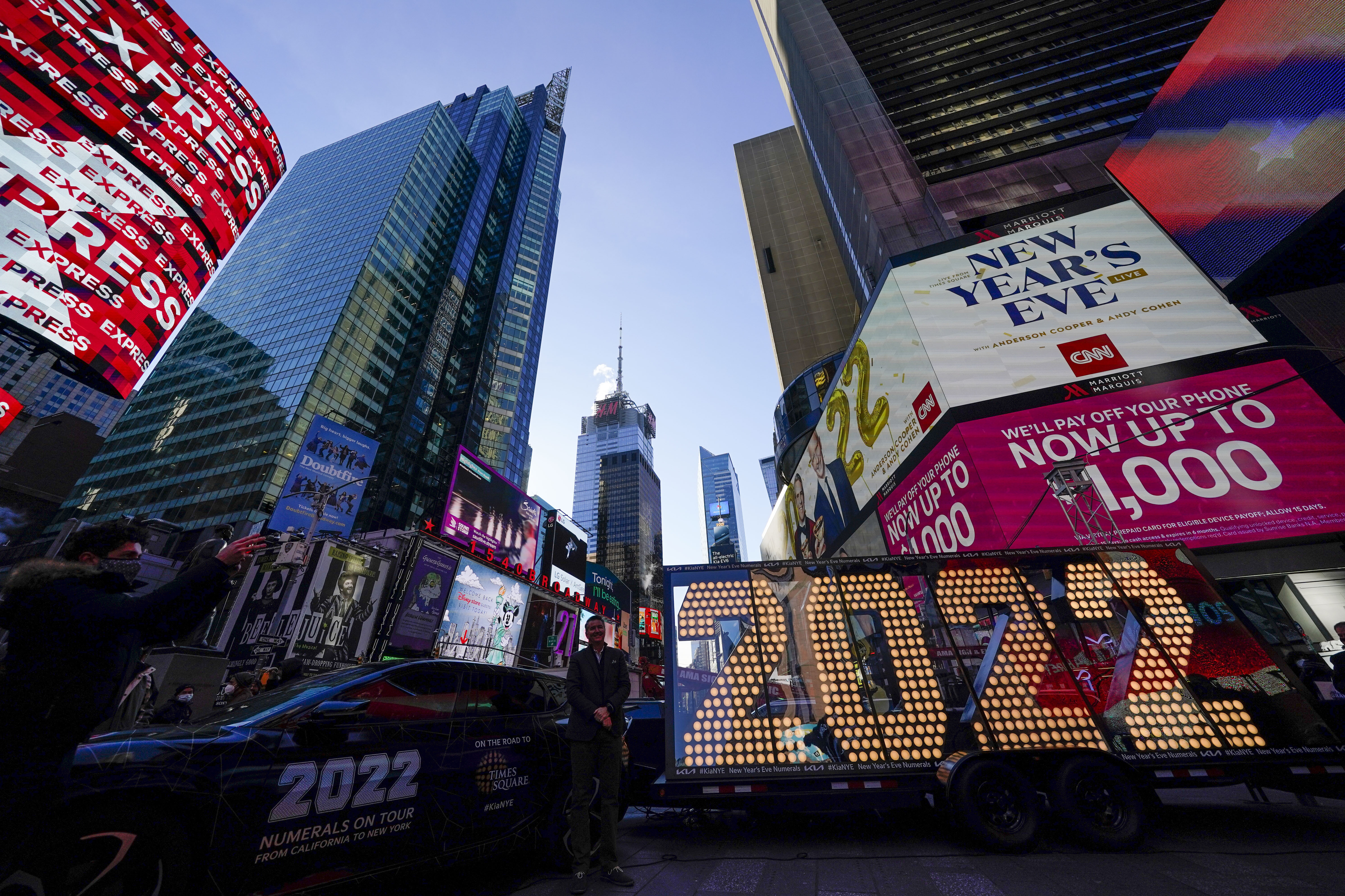 The 2022 sign that will be lit on top of a building on New Year's Eve is displayed in Times Square, New York, Monday, Dec. 20, 2021. Revelers will still ring in the new year in New York's Times Square next week, there just won't be as many of them as usual under new restrictions announced Thursday, Dec. 23, 2021, as the city grapples with a spike in COVID-19 cases.