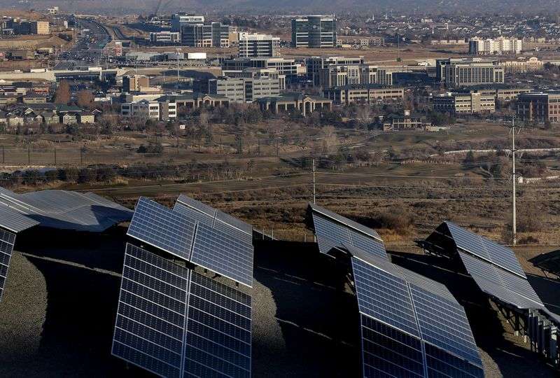 Office buildings in Lehi are pictured on Tuesday, Dec.
8, 2020. The solar panels in the foreground are at Camp
Williams.