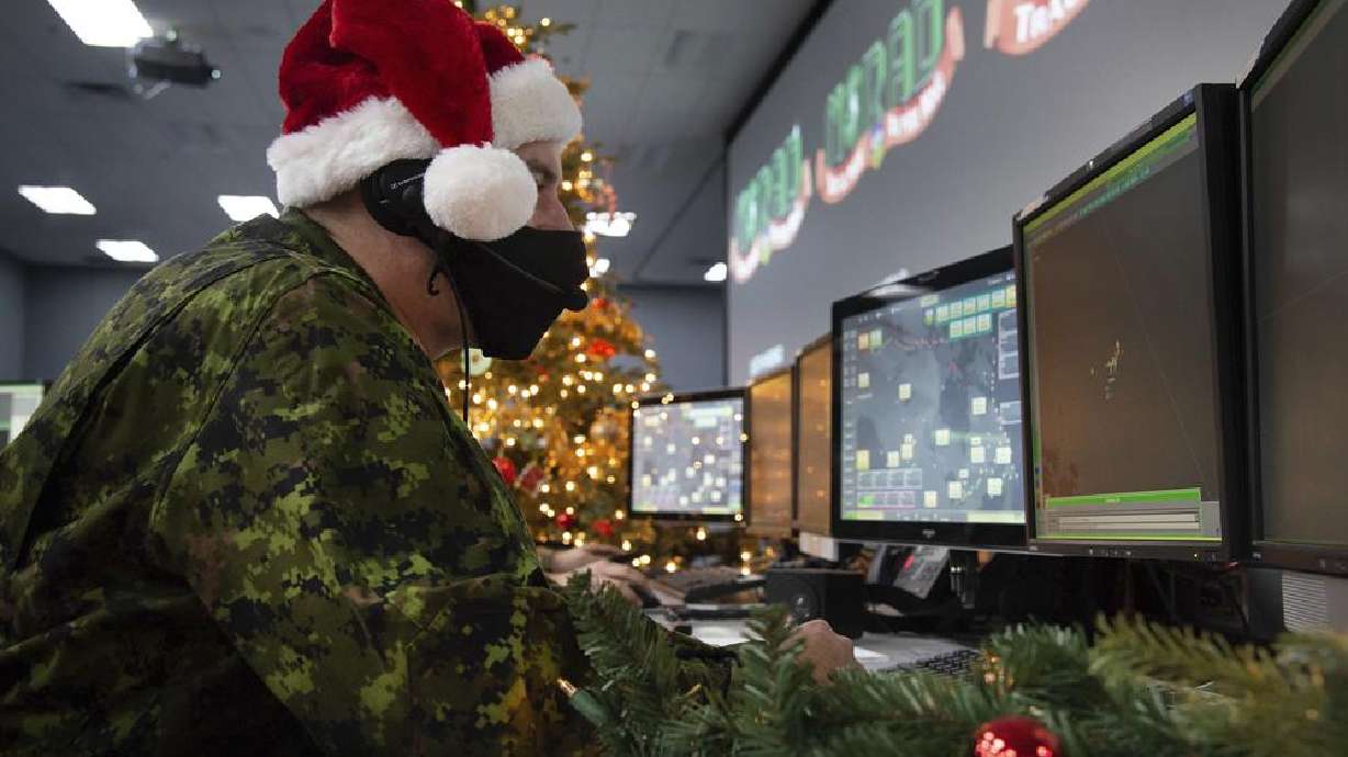Twenty-two Wing member shows how they track Santa on his sleigh on Christmas evening during a media preview at the Canadian Forces Base in North Bay on Dec. 9.