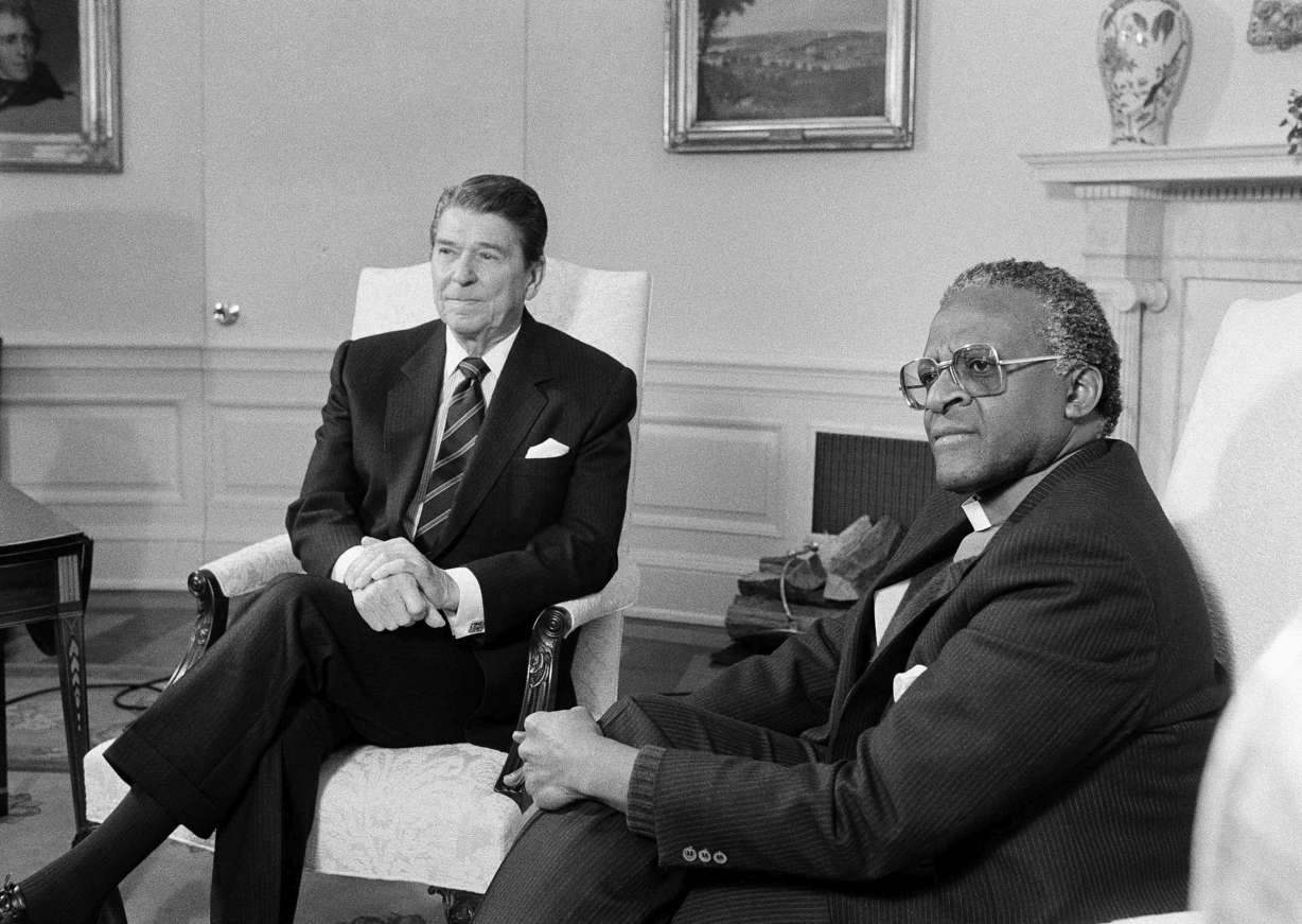 President Ronald Reagan, left, meets with South African Bishop Desmond Tutu at the White House, Dec. 7, 1984, Washington, D.C.