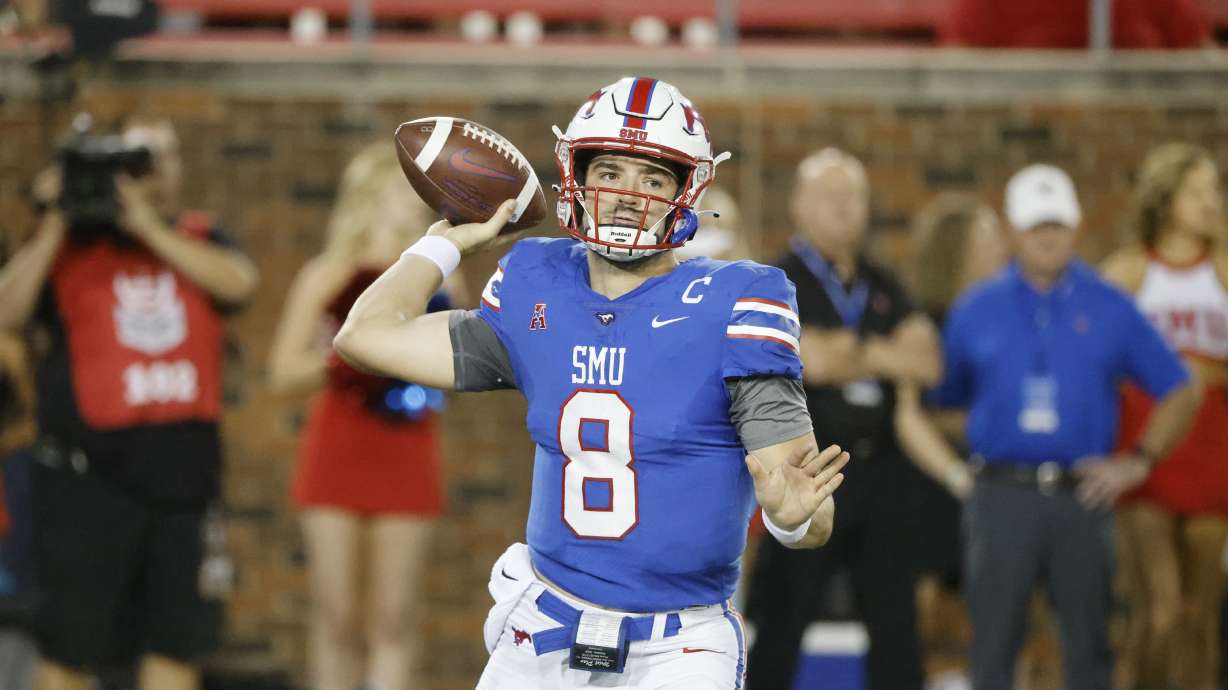 SMU quarterback Tanner Mordecai (8) throws against Tulane during the first half of an NCAA college football game in Dallas, Thursday, Oct. 21, 2021. The Mustangs will play BYU for the first time since 1997 in the New Mexico Bowl.