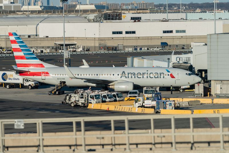 An American Airlines airplane is seen at John F. Kennedy International Airport during the spread of the omicron coronavirus variant in Queens, New York City, Sunday.