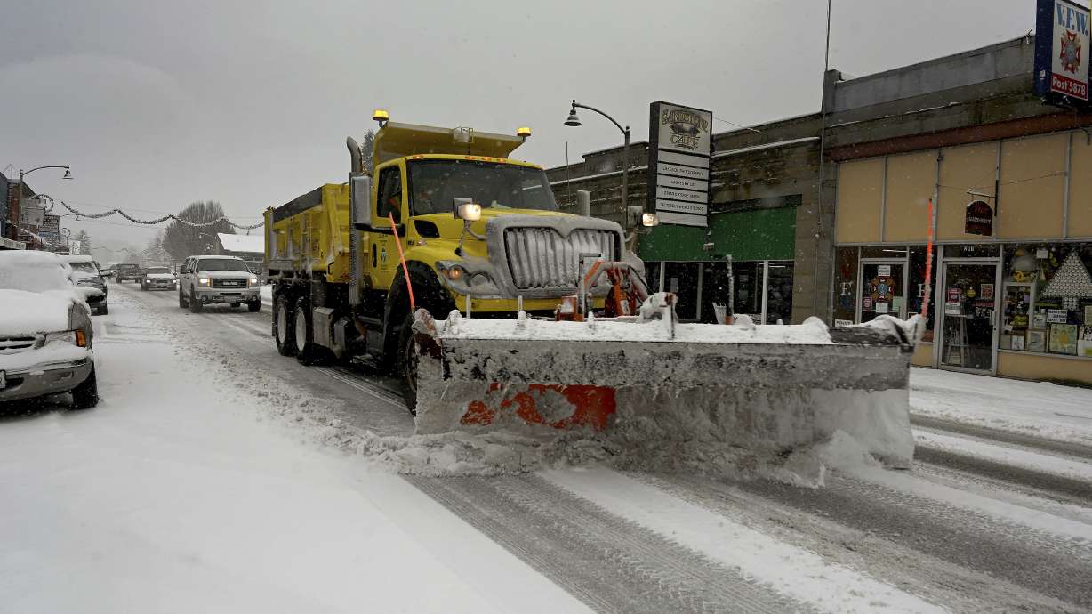 A snow plow travels down a street in Tenino, Wash. on Sunday, Dec. 26, 2021. Several inches of snow fell overnight in the south sound area which made traveling a challenge on many parts of Thurston County.