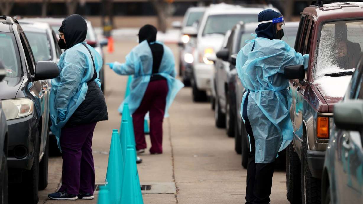 People in a long line of cars wait to be tested for COVID-19 outside of the Utah Department of Health in Salt Lake City on Monday. Utah reported a surprising 3,303 new cases on Wednesday — the highest single-day count in almost a year.