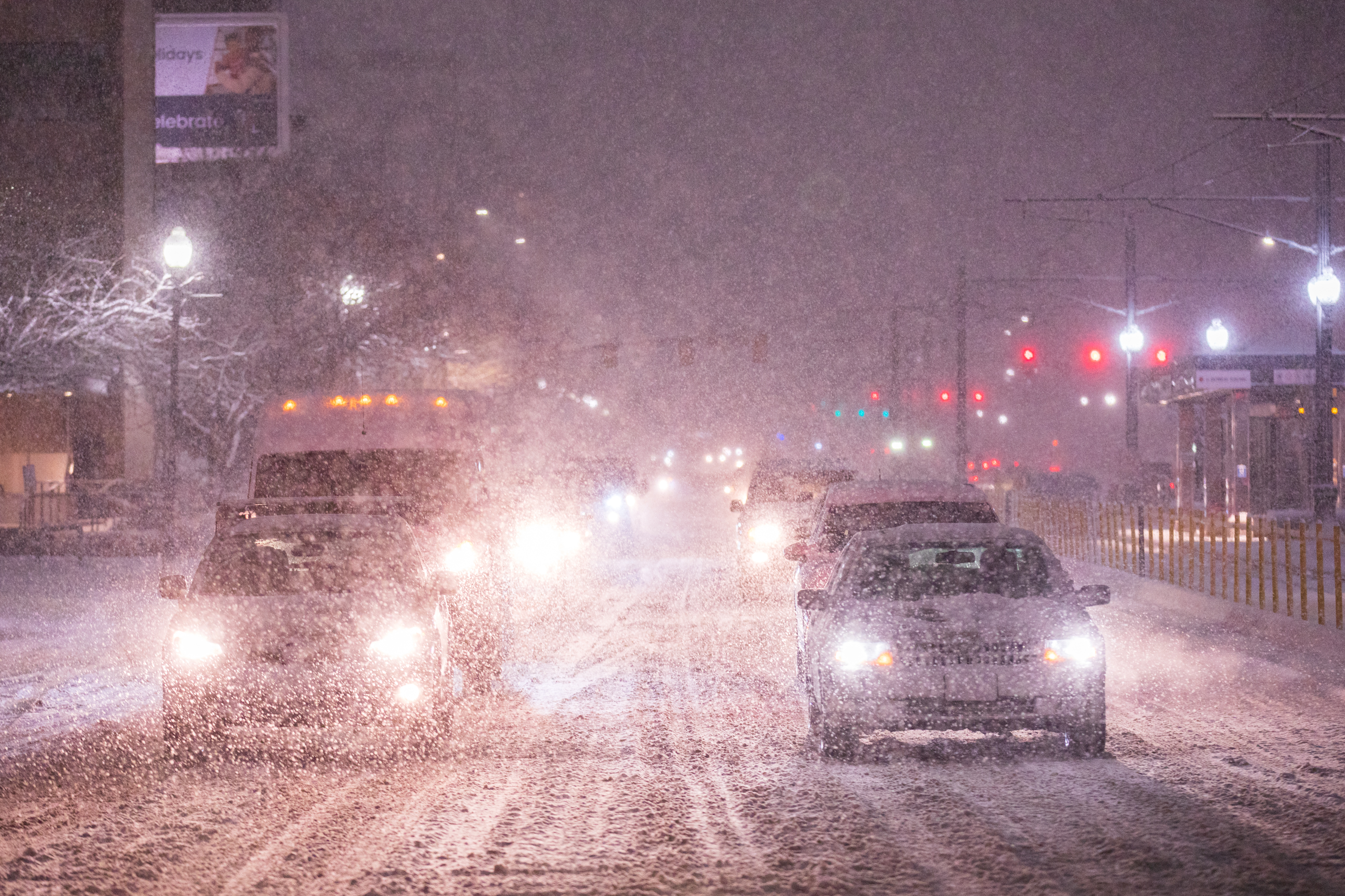 Motorists drive through the snow on 400 South in Salt Lake City on Monday night.