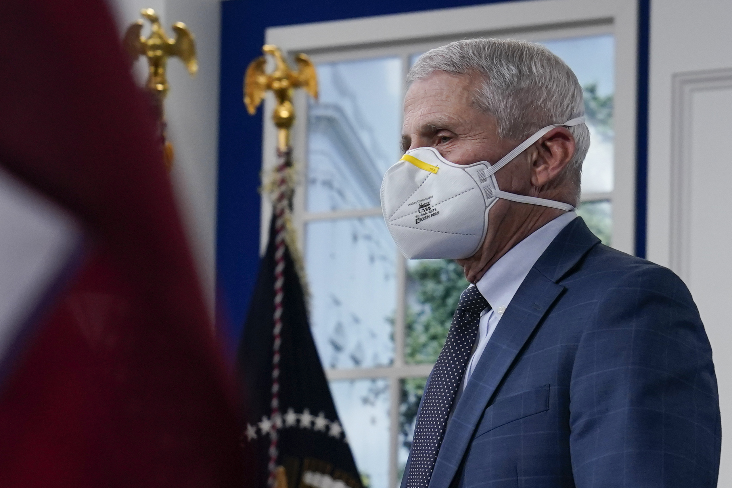 Dr. Anthony Fauci arrives at the White House Campus, Monday, in Washington. Fauci says the U.S. should consider a vaccination mandate for domestic air travel as coronavirus infections surge.