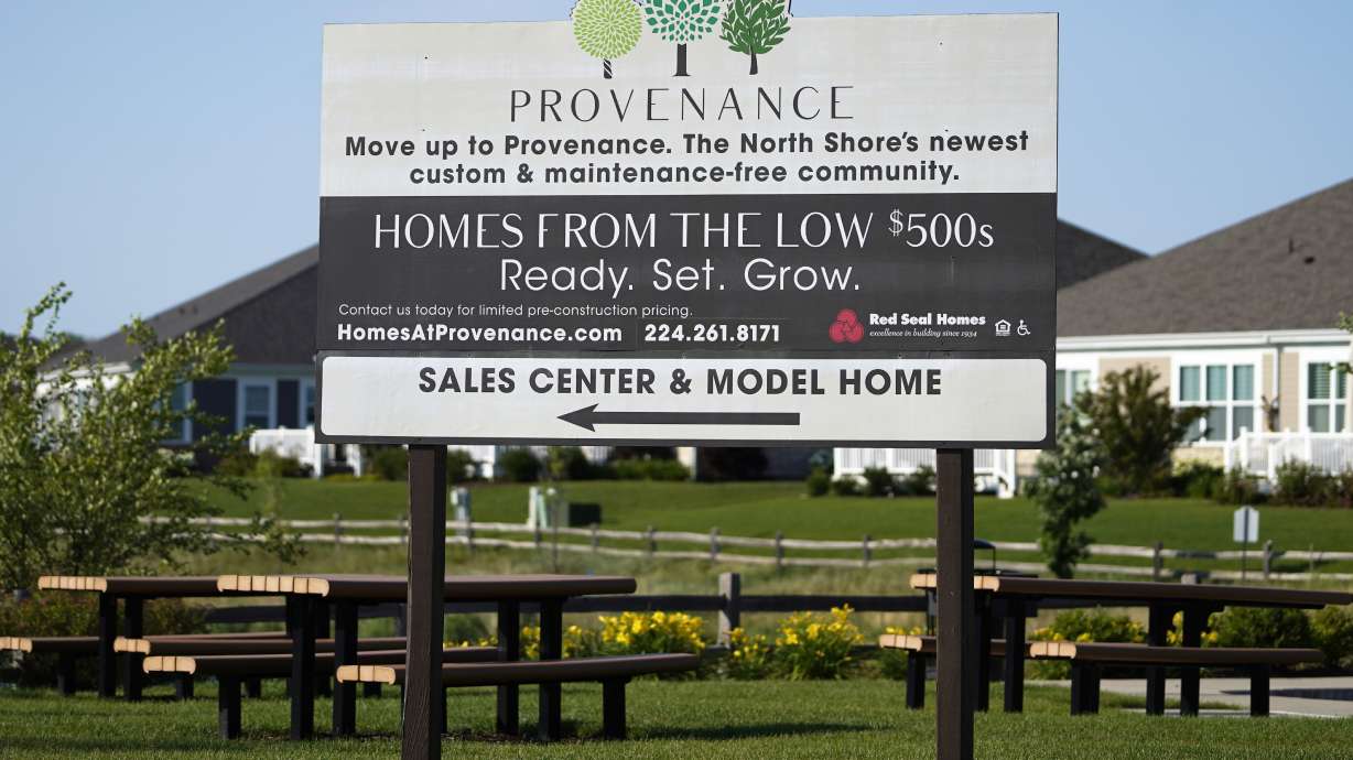 A homes sale sign is shown in Northbrook, Ill., June 23. U.S. home prices surged again in October.