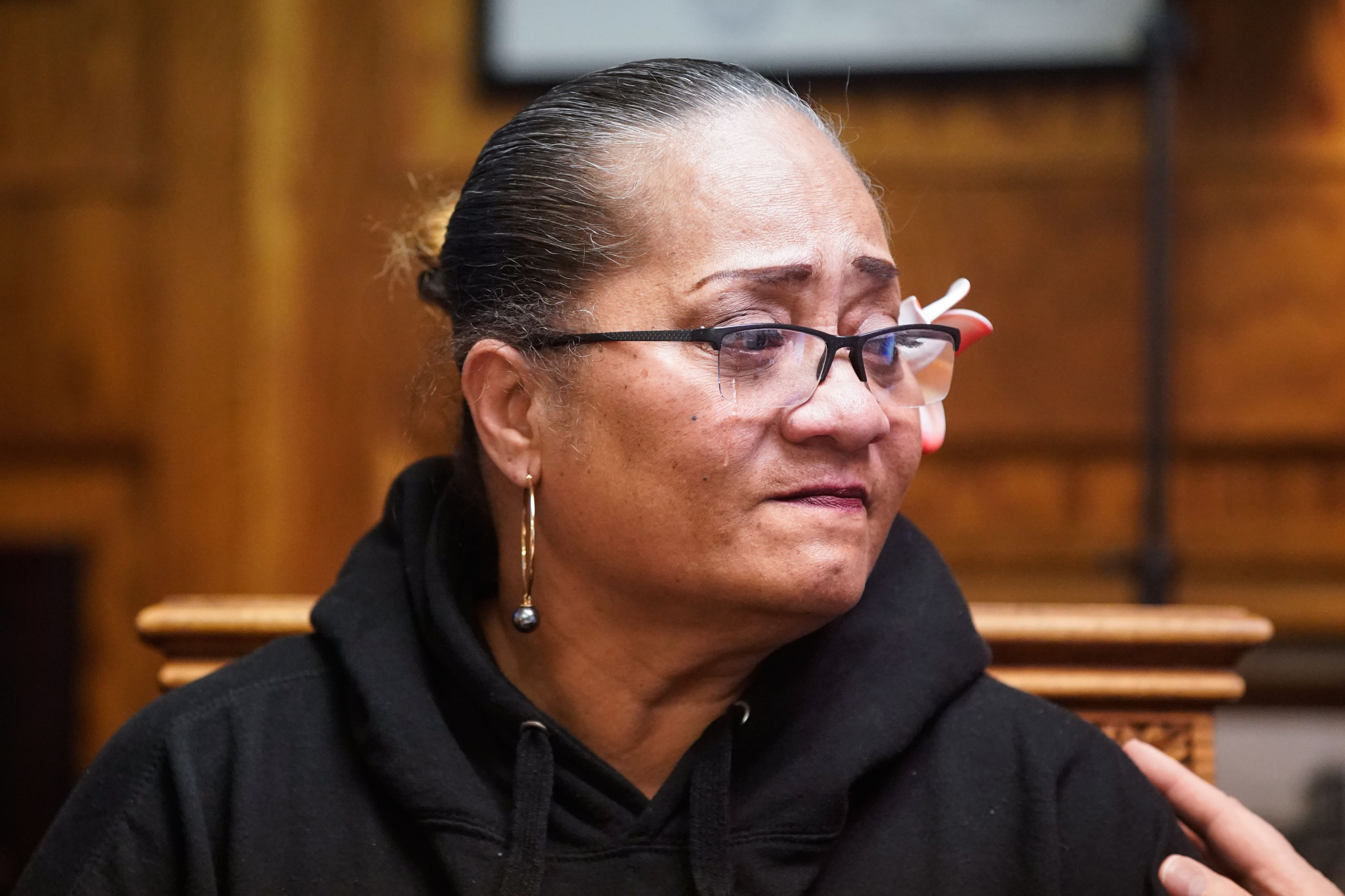 Nonnie Masaniai, mother of Atonio Sivatia, sheds a tear during a press conference in Salt Lake City on Tuesday.