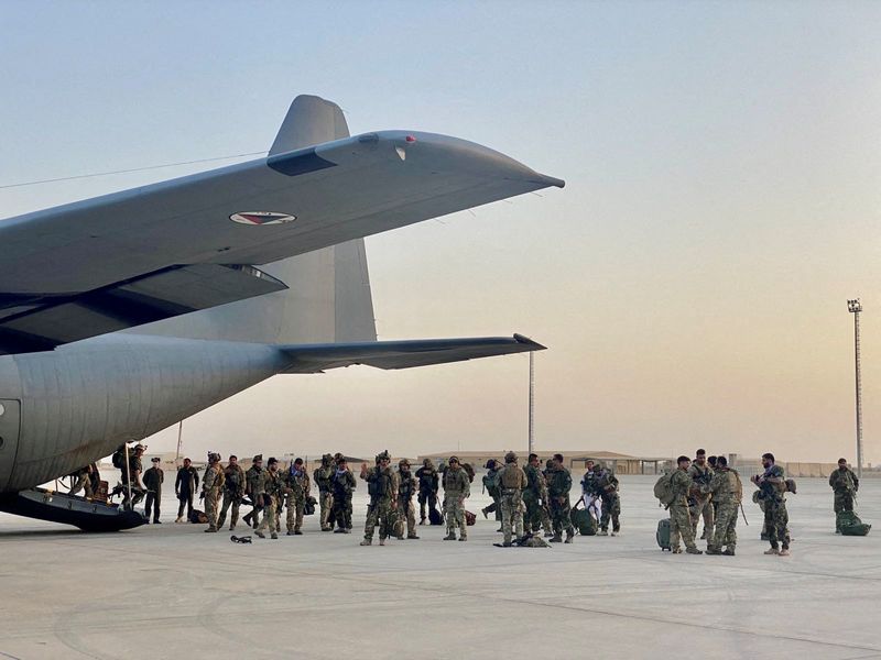 An Afghan Air Force C-130 at Camp Shorabak, Helmand province, Afghanistan, unloading Special Forces troops who are heading to battle against the Taliban Aug. 3.