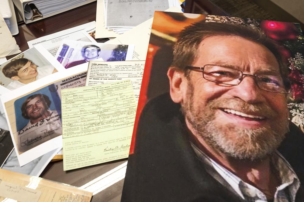 Photos, a driver's license, the original warrant and other items from a 1969 robbery involving Ted Conrad are shown on Dec. 16, 2021 at the Carl B. Stokes U.S. Courthouse in Cleveland.