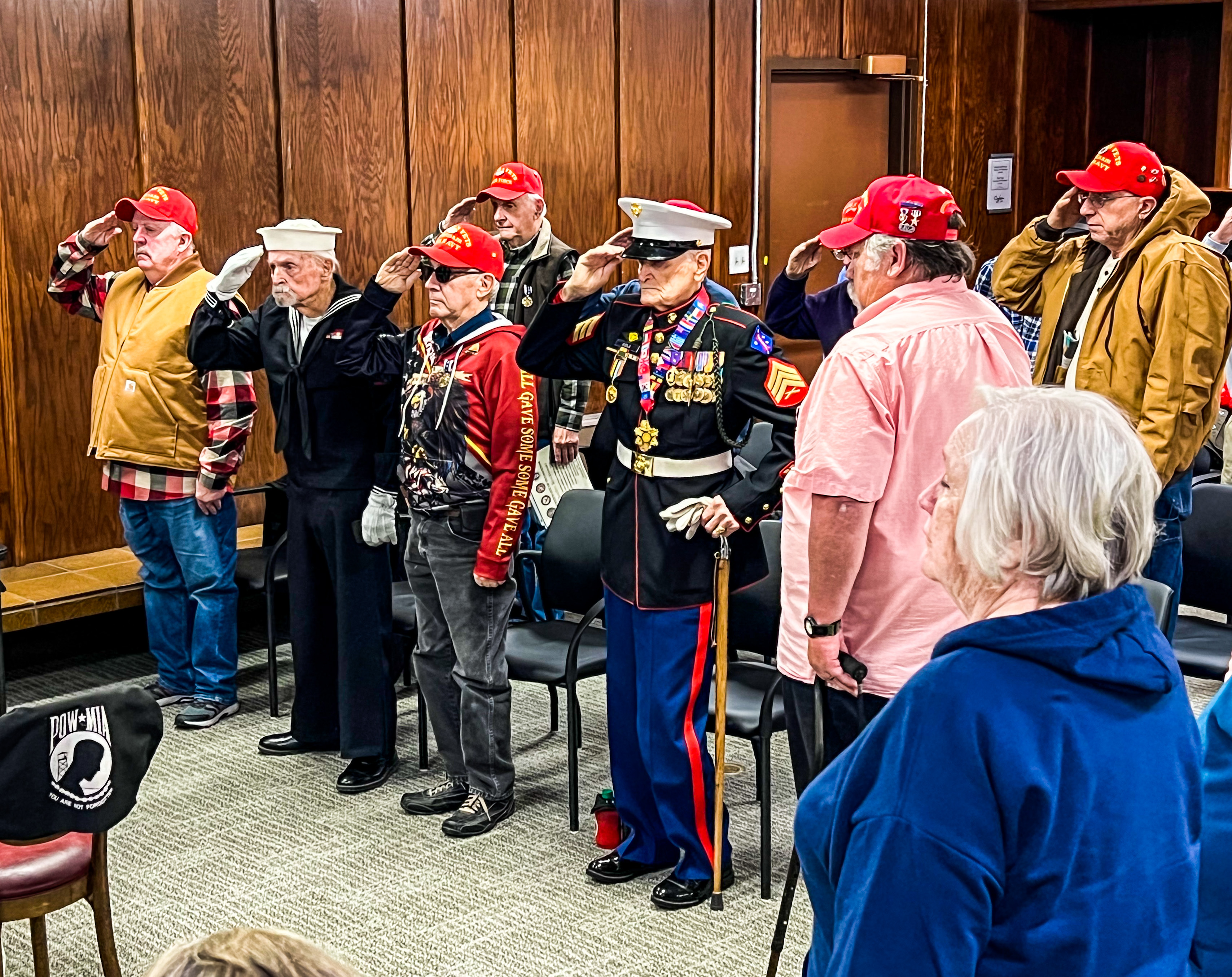 Utah Cold War veterans salute during a victory medal ceremony on Wednesday, at the Golden Hours Senior Center in Ogden.