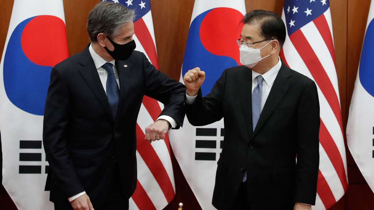 U.S. Secretary of State Antony Blinken, left, bumps elbows with South Korean Foreign Minister Chung Eui-yong in Seoul on March 18.