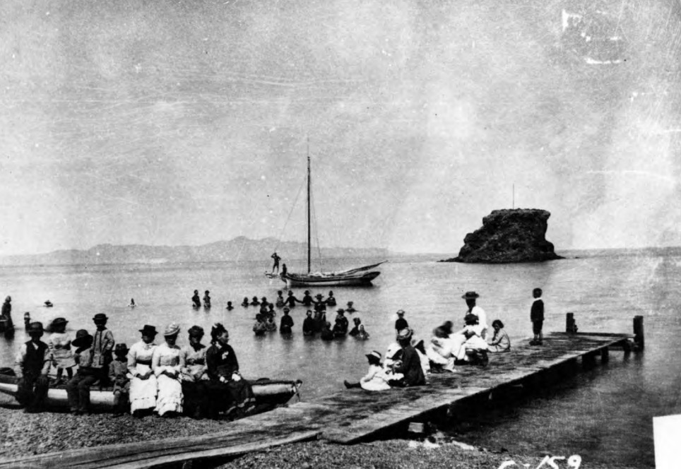 A photo taken from "Blackrock Beach" on the shores of the Great Salt Lake in the 1870s. The Black Rock Site, which can be seen in the distance, was used as a water level measuring site in the 1870s, but is no longer underwater.